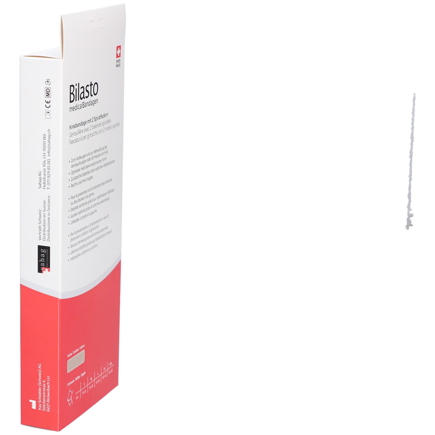 Kniebrace verpakking, schuin. Opschrift: Bilasto medicalBandagen. Rode en witte kleuren. Swiss Made.