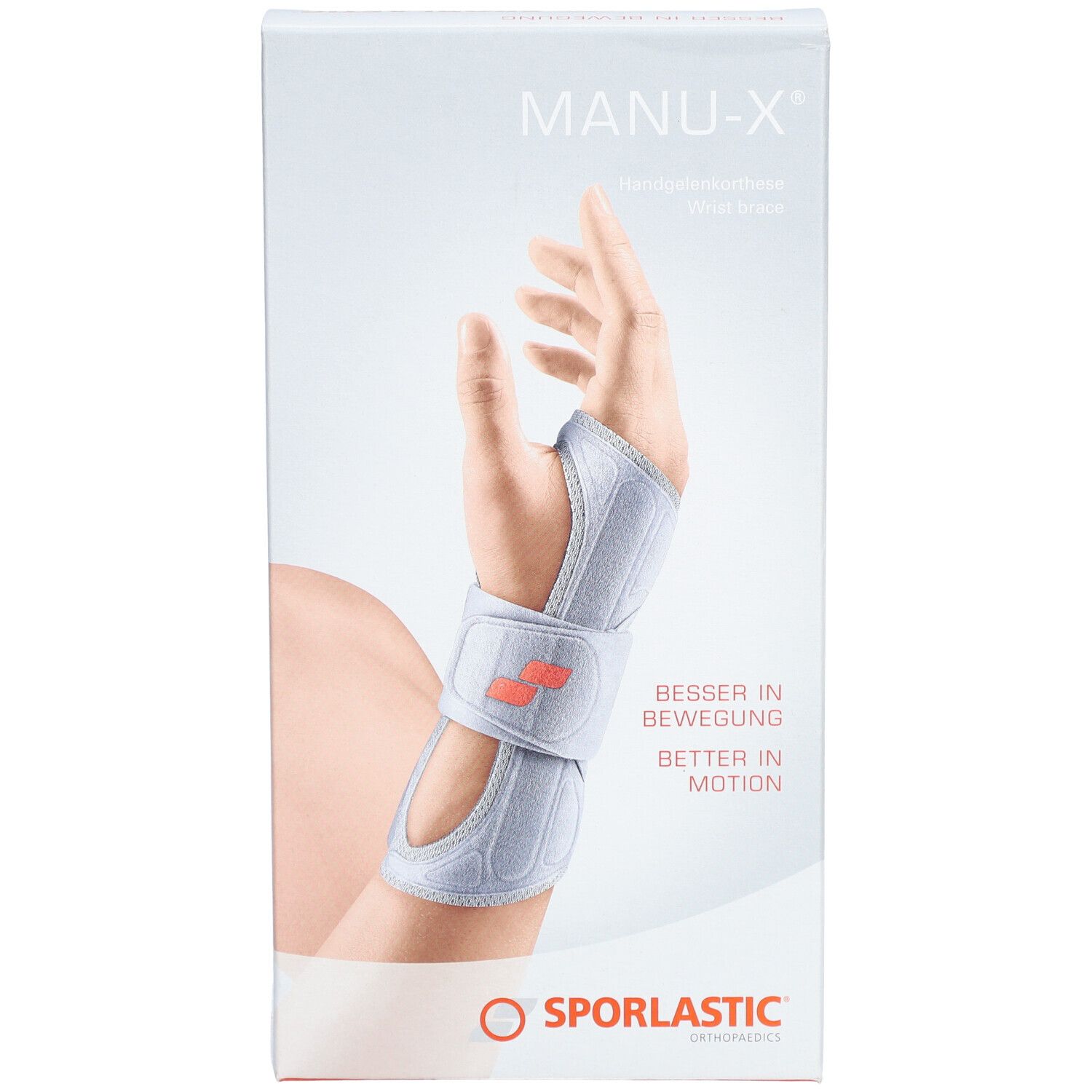 Verpakking van de polsbrace MANU-X. Toont een hand met brace. Merk SPORLASTIC. Tekst: BESSER IN BEWEGUNG, BETTER IN MOTION.