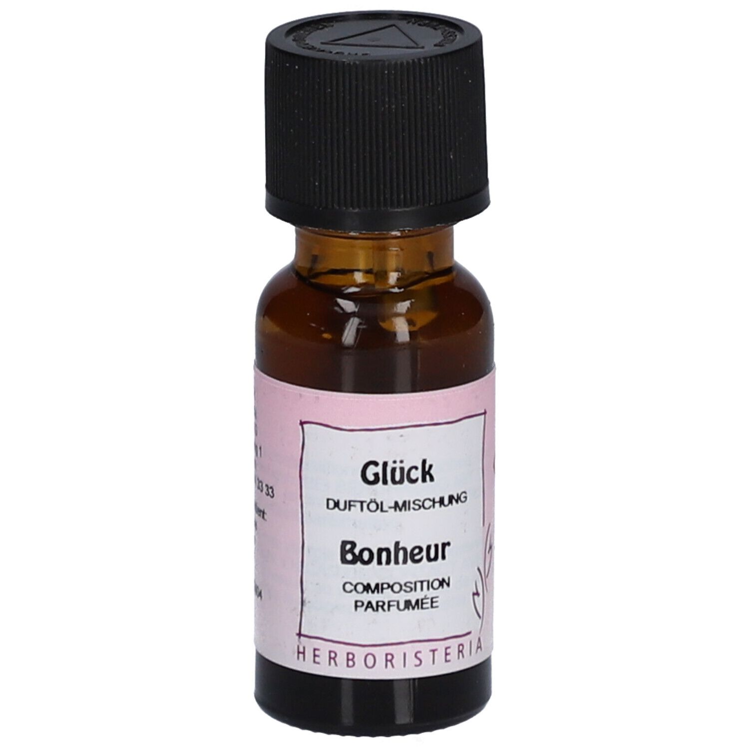 Bruine glazen fles met zwarte dop. Etiket met tekst: Glück, Duftöl-Mischung, Bonheur, Composition Parfumée. Merk: HERBORISTERIA.