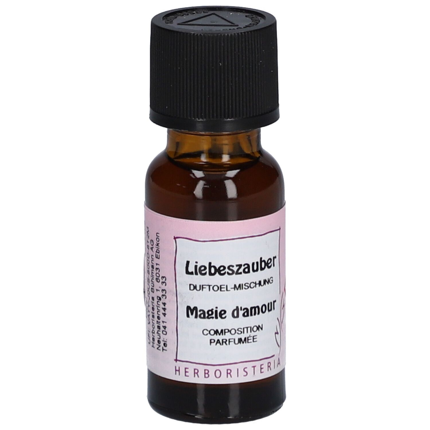Bruine glazen fles met zwarte dop. Etiket met tekst: Liebeszauber, Magie d'amour, HERBORISTERIA.
