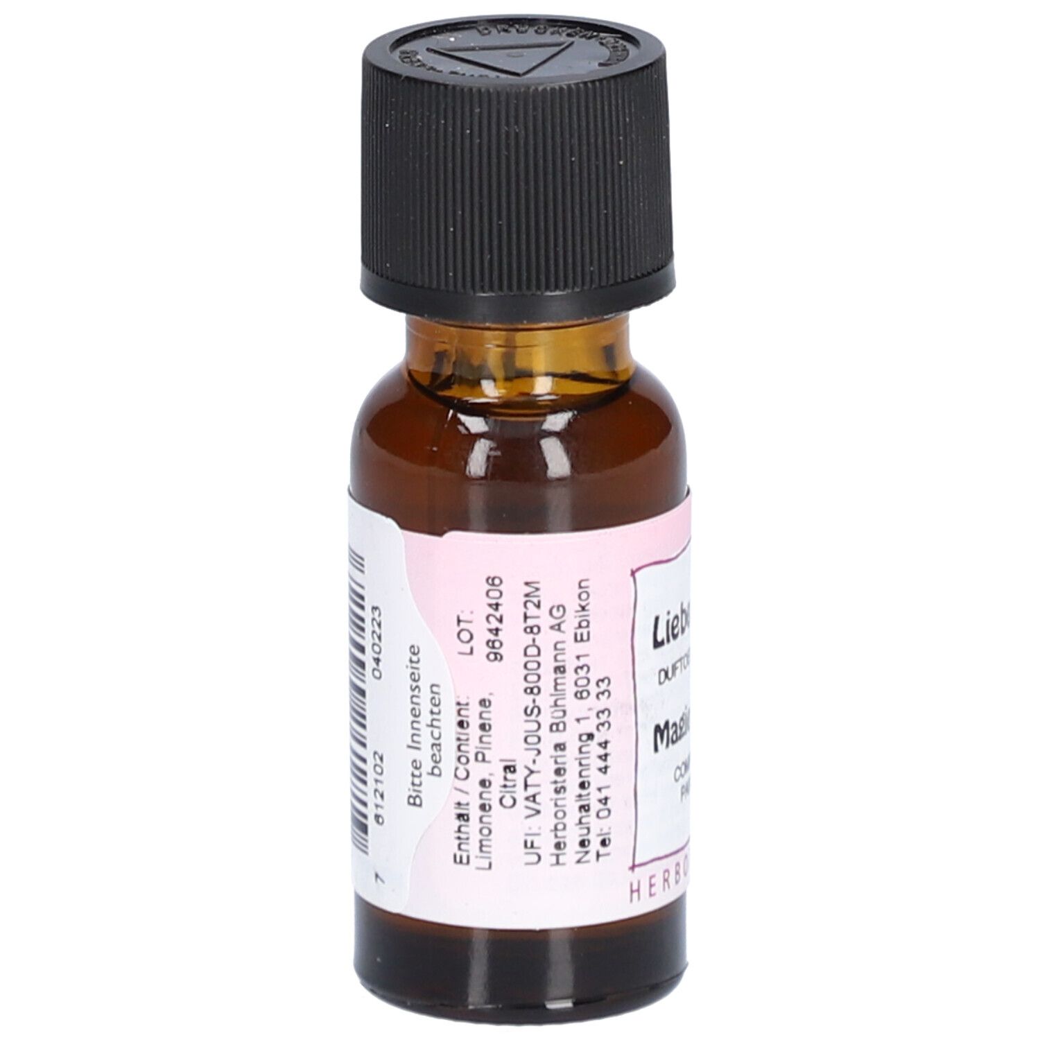 Bruine glazen fles met zwarte dop. Etiket met ingrediënten en fabrikant informatie.