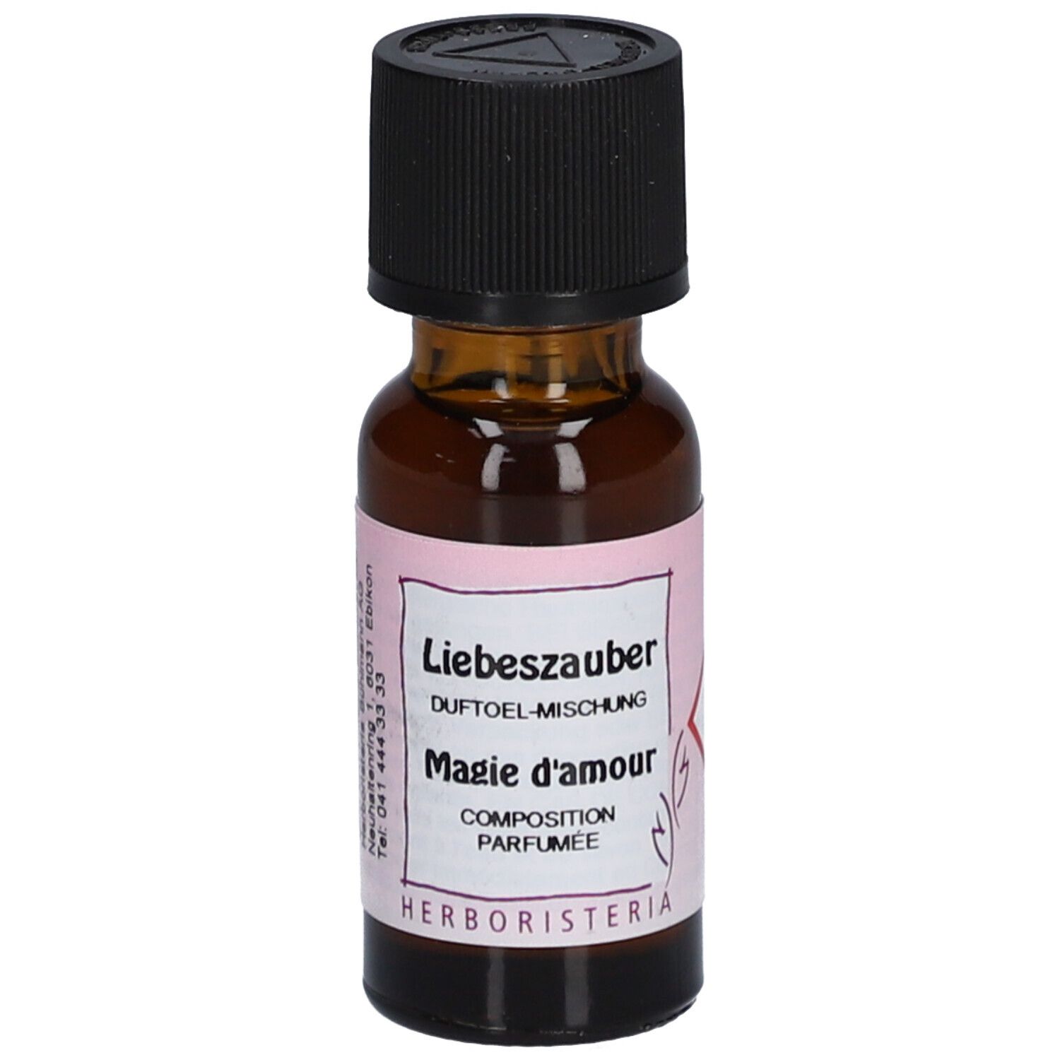 Bruine glazen fles met zwarte dop. Etiket met tekst: Liebeszauber, Magie d'amour, HERBORISTERIA.