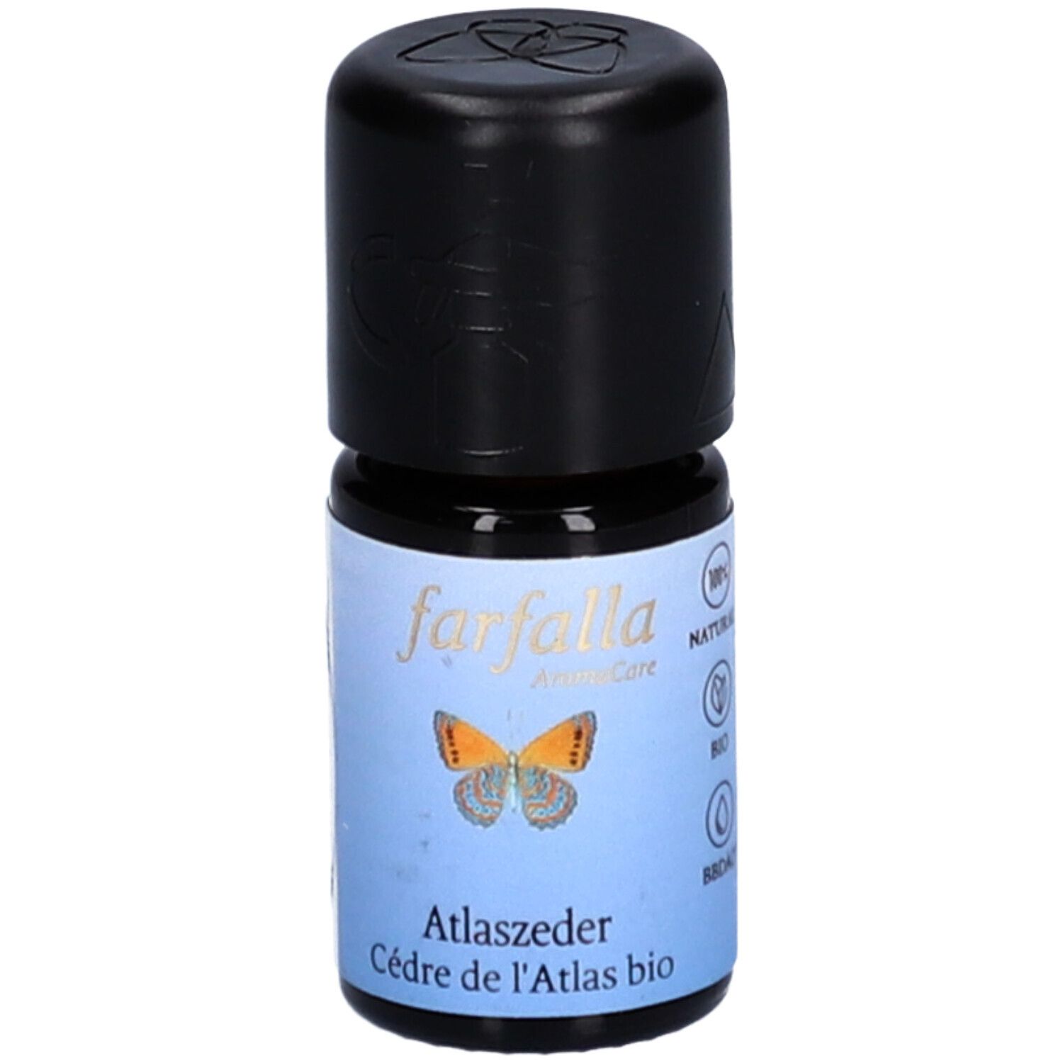 Petite bouteille en verre avec bouchon noir. Étiquette avec texte: Cèdre de l'Atlas bio. Logo: papillon. Marque: farfalla AromaCare.
