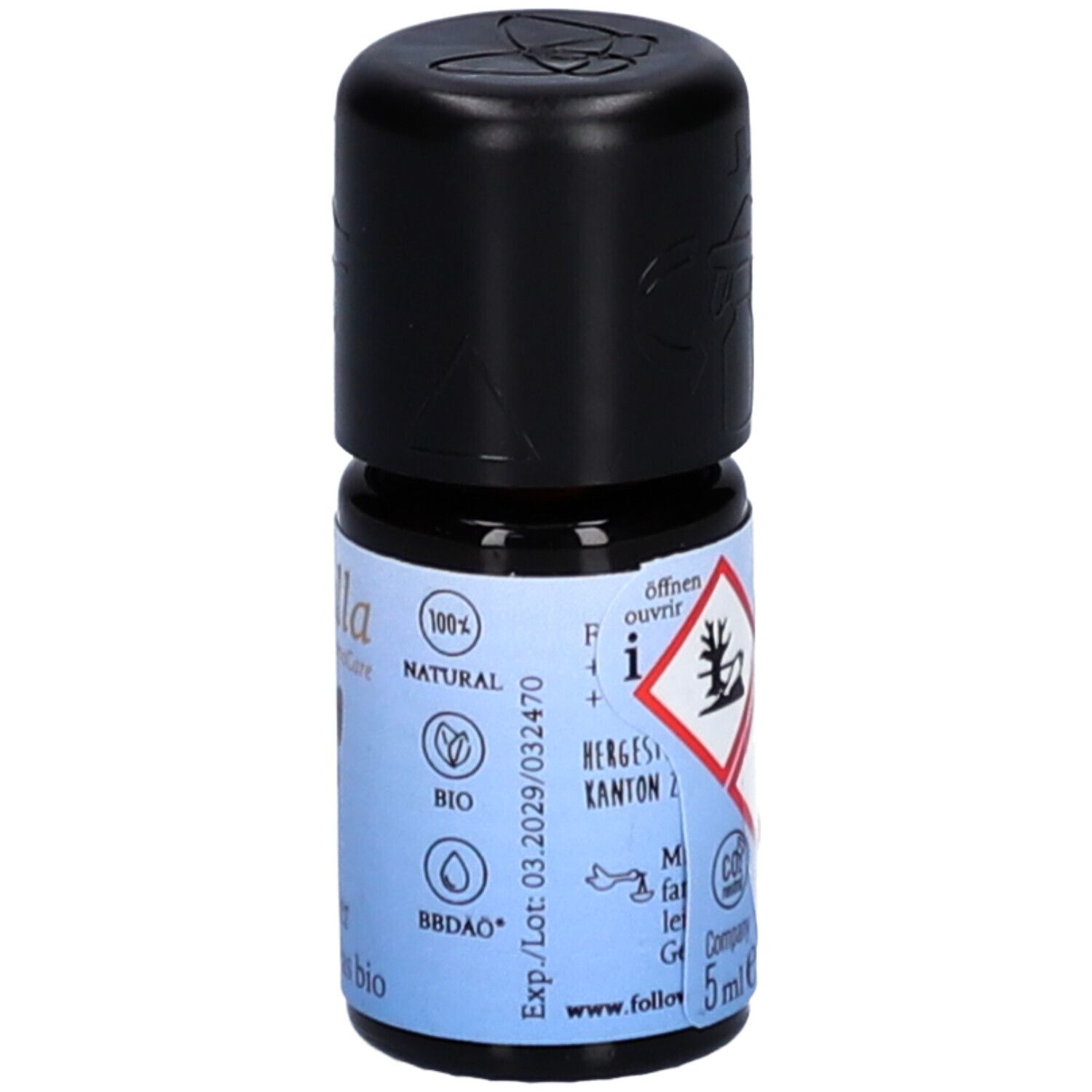 Petite bouteille en verre avec bouchon noir. Étiquette avec texte, logos et symboles de danger. Volume: 5ml. Marque: farfalla AromaCare.