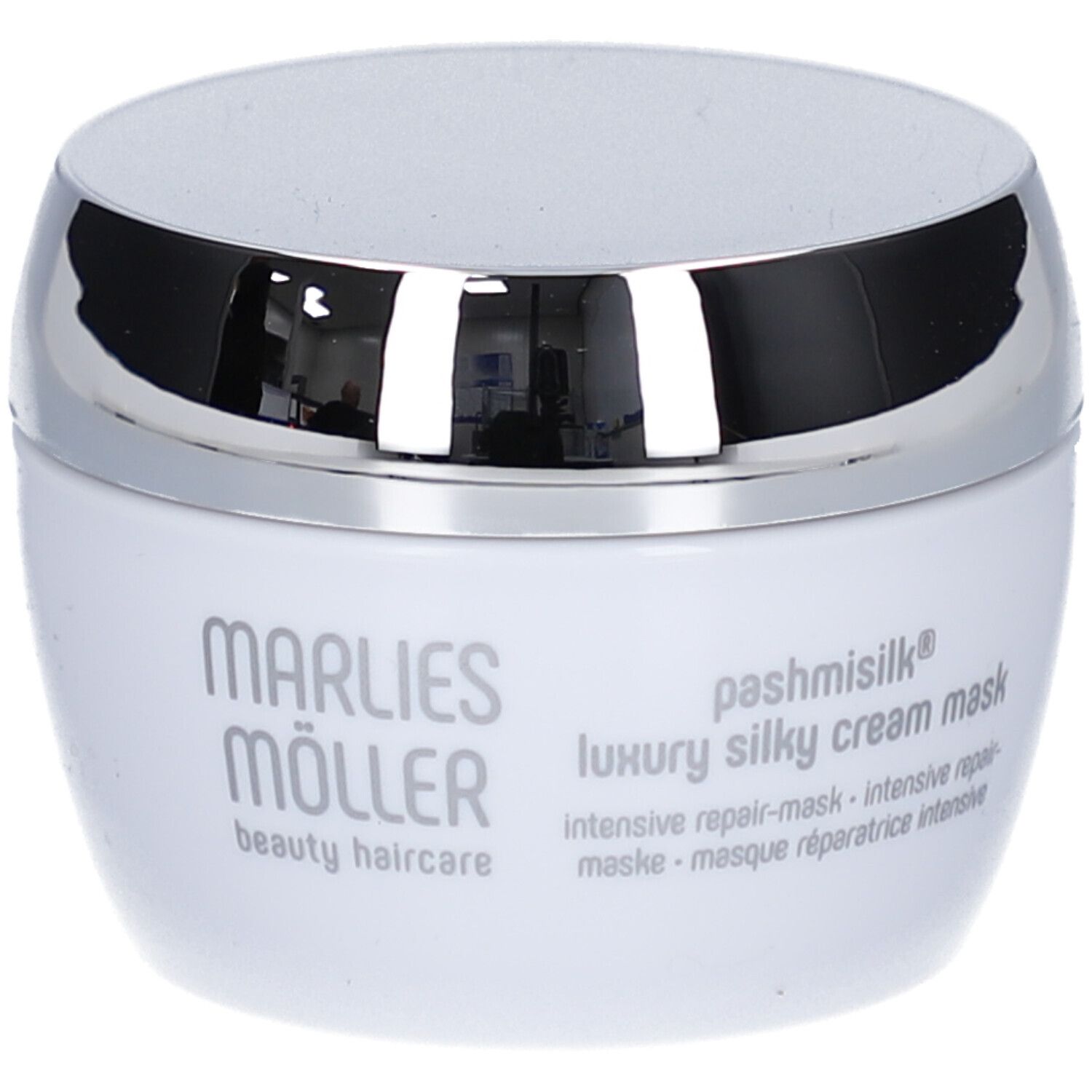 Pot blanc à couvercle argenté. Inscription: Marlies Möller, Pashmisilk, Luxury Silky Cream Mask.