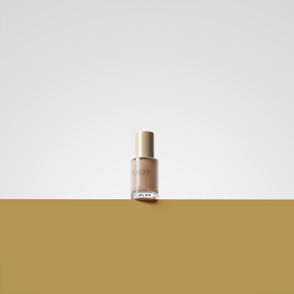 Flacon en verre avec bouchon doré. Sur fond doré.