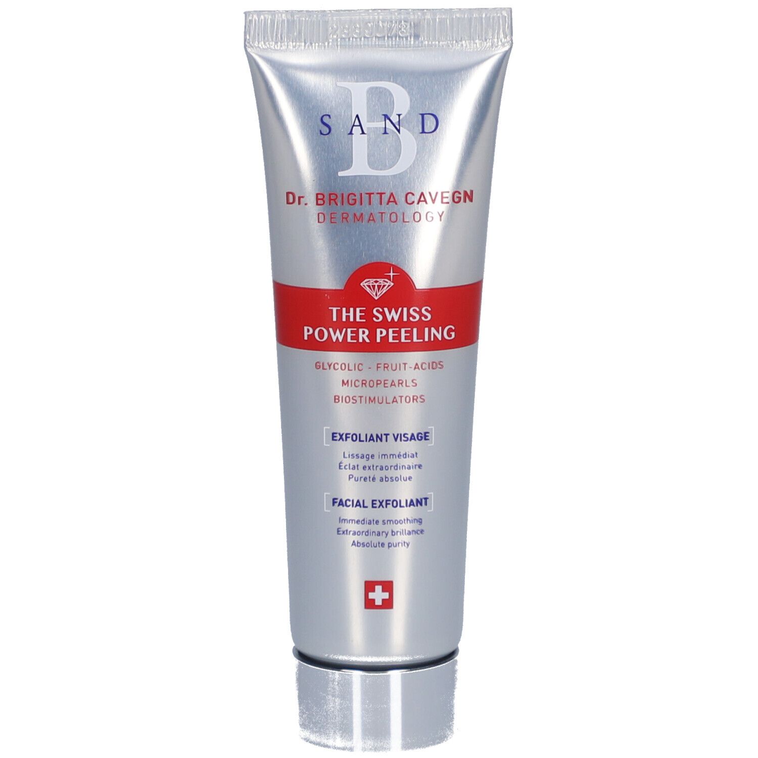 Tube argenté avec bande rouge. Inscription: B SAND, Dr. Brigitta Cavegn, THE SWISS POWER PEELING, Exfoliant Visage, Croix suisse.