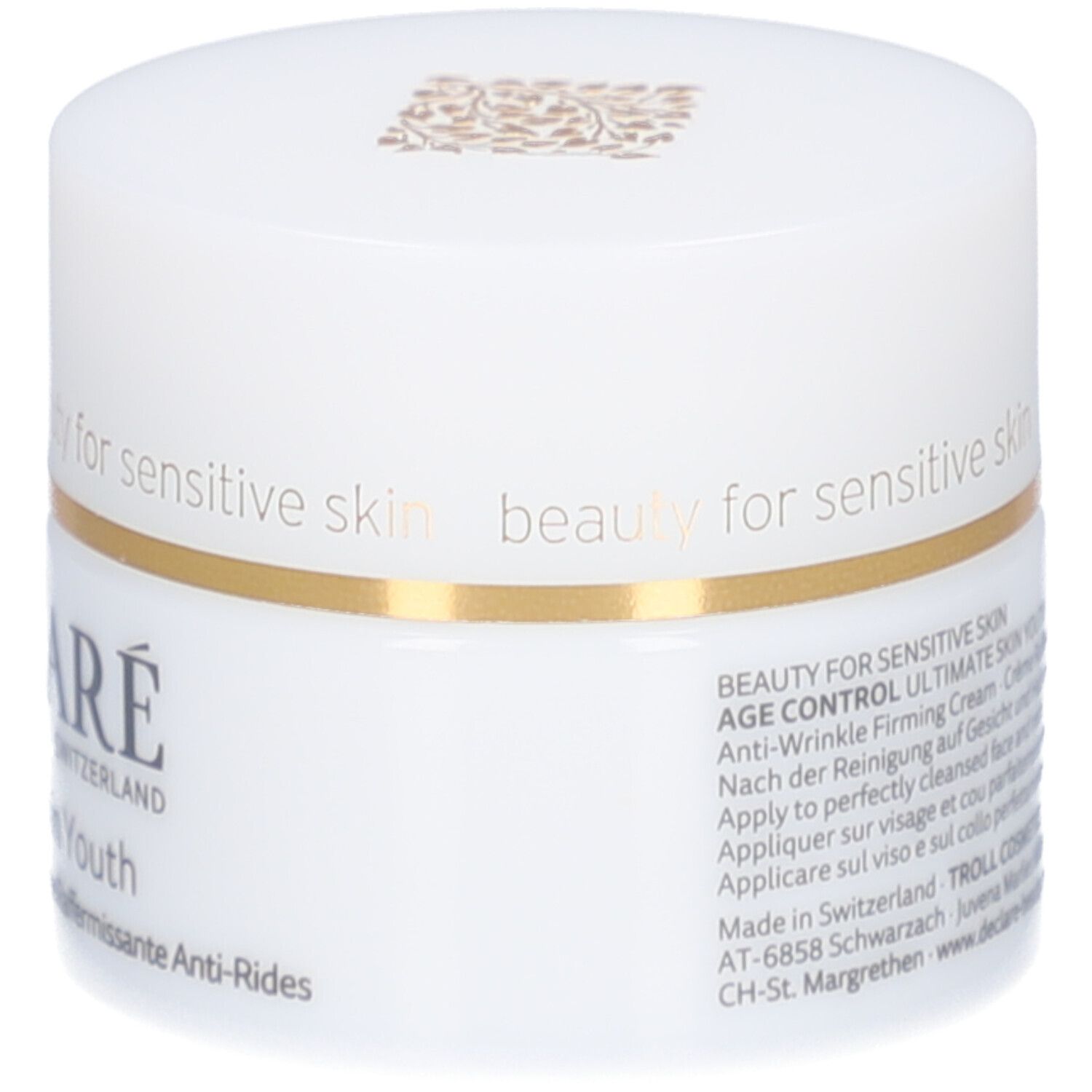 Witte pot met gouden rand. DECLARÉ, Ultimate Skin Youth. Achterkant met tekst en symbolen.