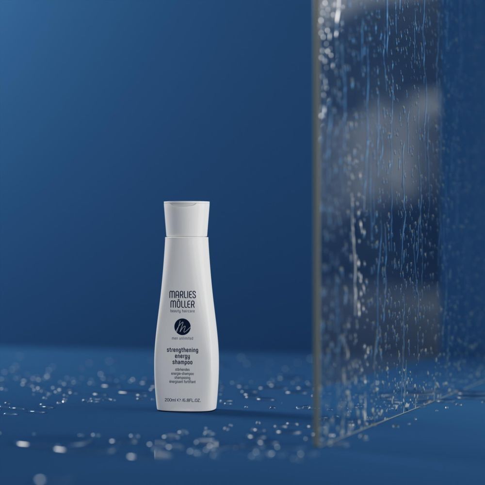 Shampooing Marlies Möller sur fond bleu. Nom du produit et logo visibles.