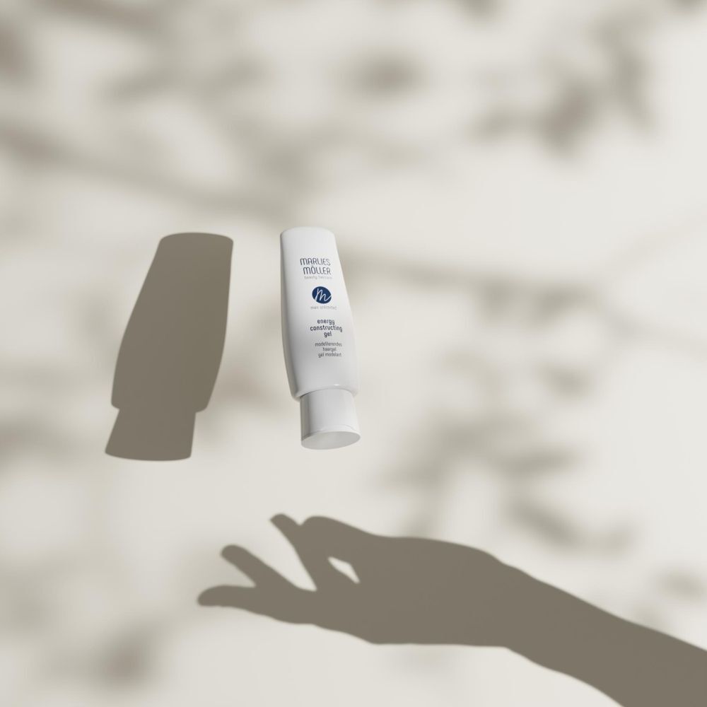 Flacon de gel capillaire blanc avec ombre. Inscription: Marlies Möller, Men Unlimited, Energy Constructing Gel.