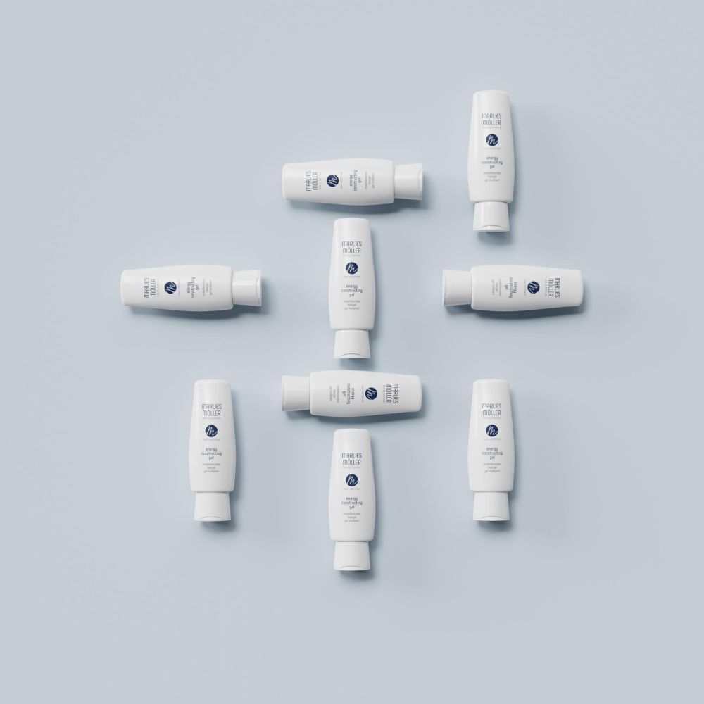 Plusieurs flacons de gel capillaire blancs sur fond bleu. Inscription: Marlies Möller, Men Unlimited, Energy Constructing Gel.
