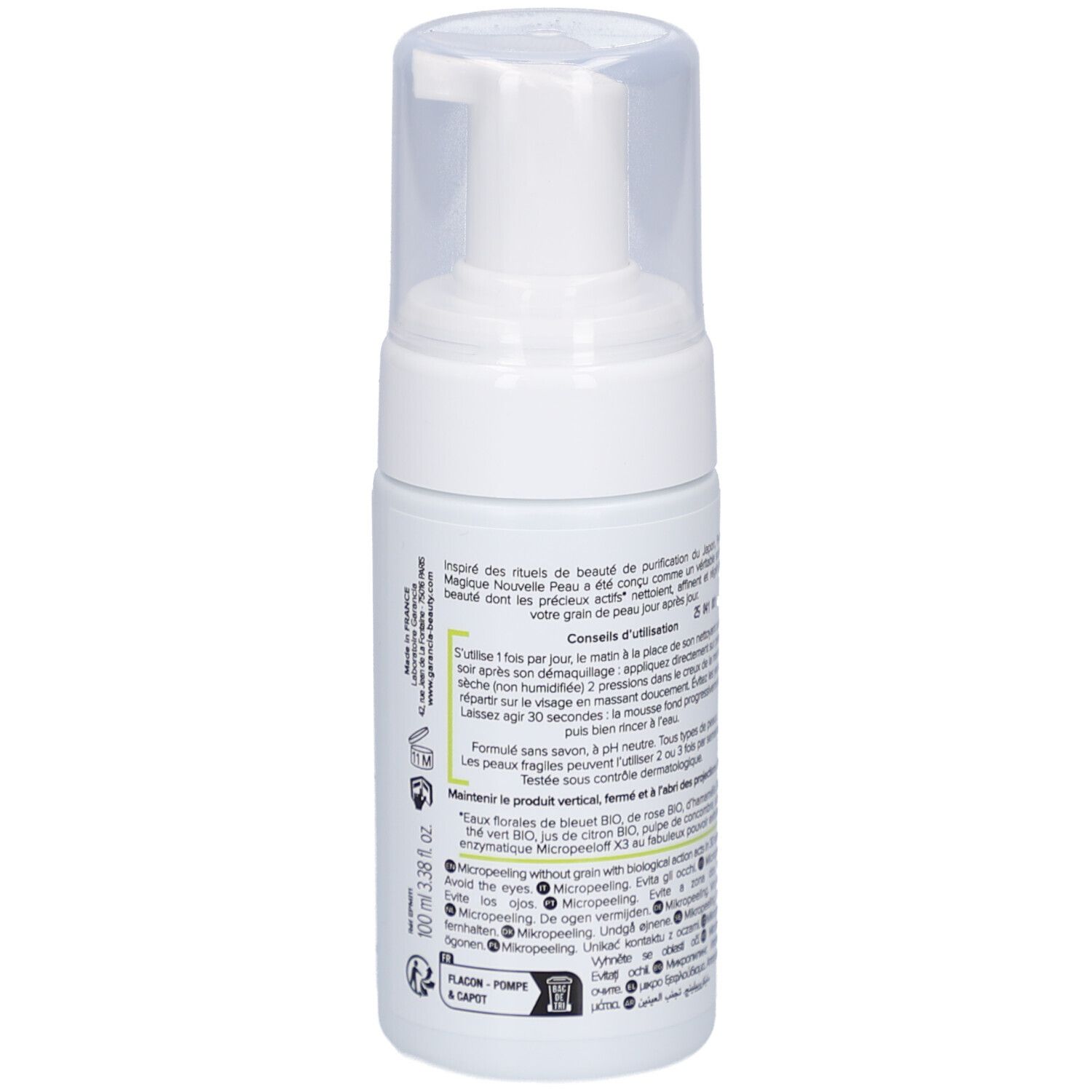 Witte fles met pomp. Opschrift: GARANCIA, Pschitt Magique, Nouvelle Peau, Visage. Franse tekst.