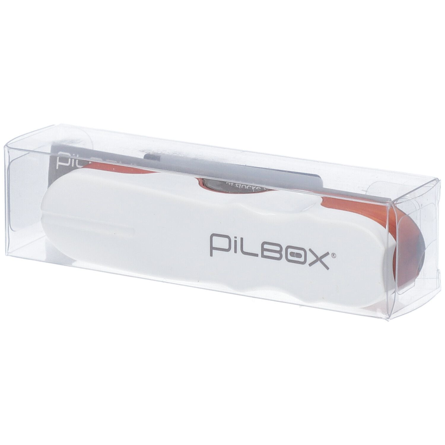 Pilbox tablettensnijder in transparante verpakking. Wit met oranje element. PILBOX logo.