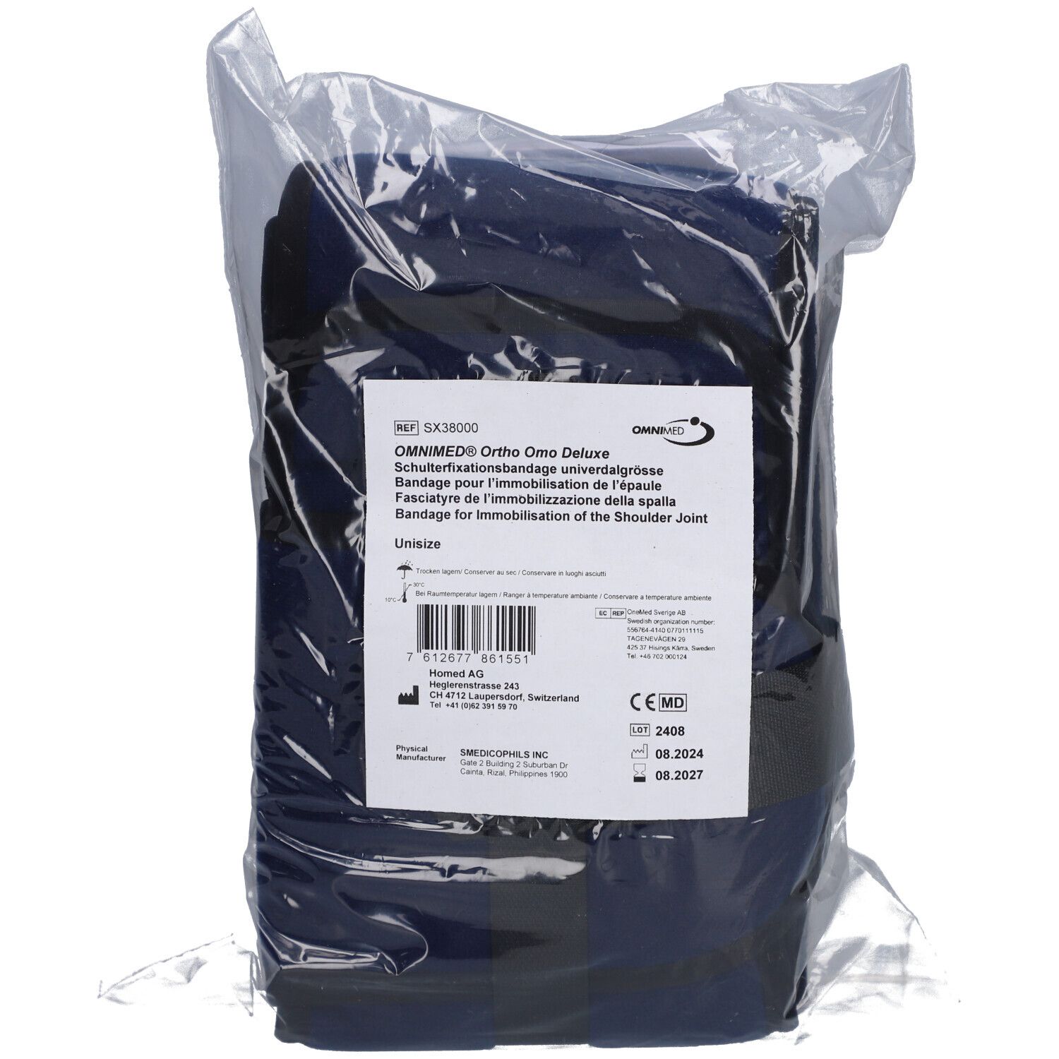 Bandage d'épaule Omnimed Ortho Omo Deluxe bleu, emballé. Étiquette avec texte et marquage CE.