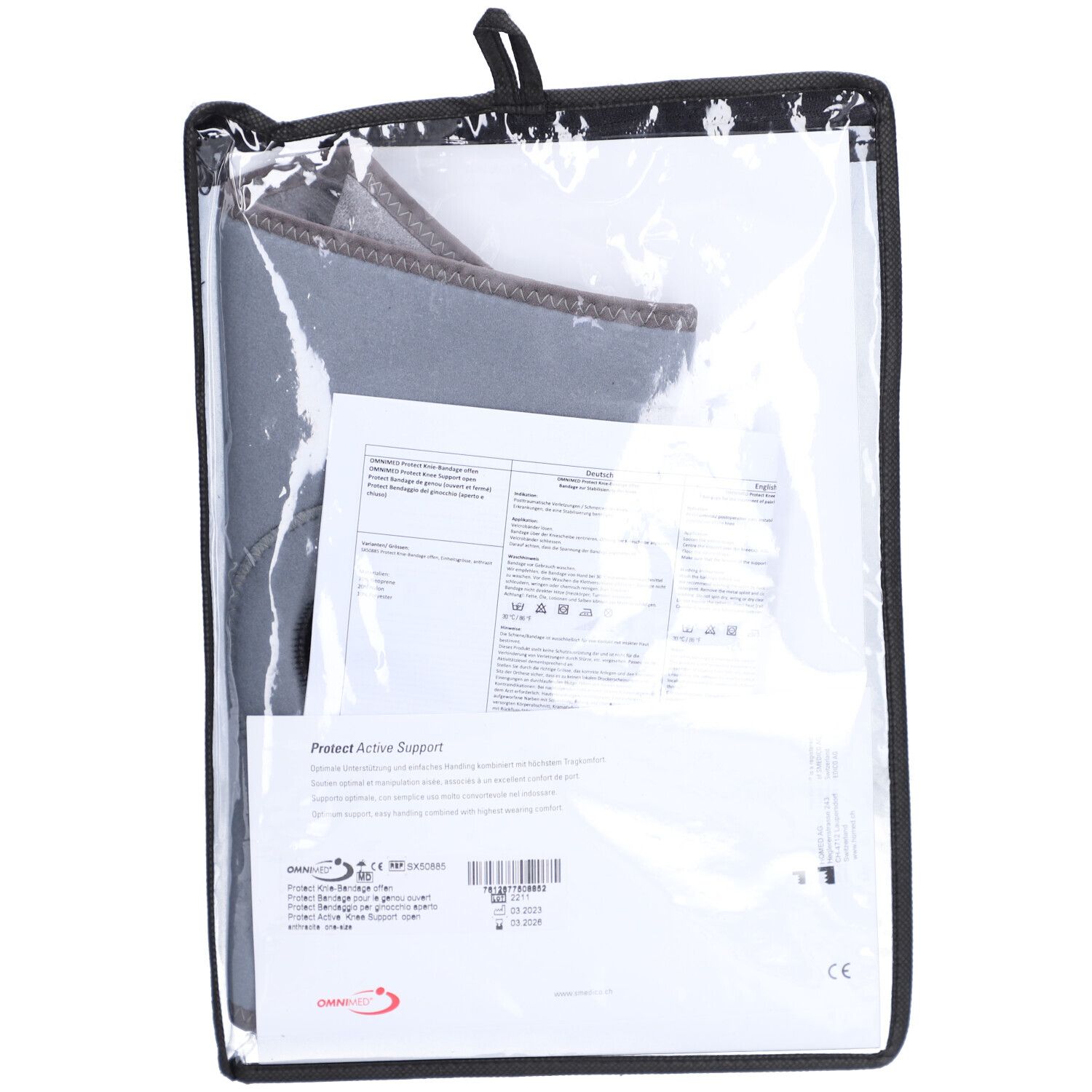 Genouillère dans un emballage. Contient du papier d'information. Sac transparent avec bord noir.