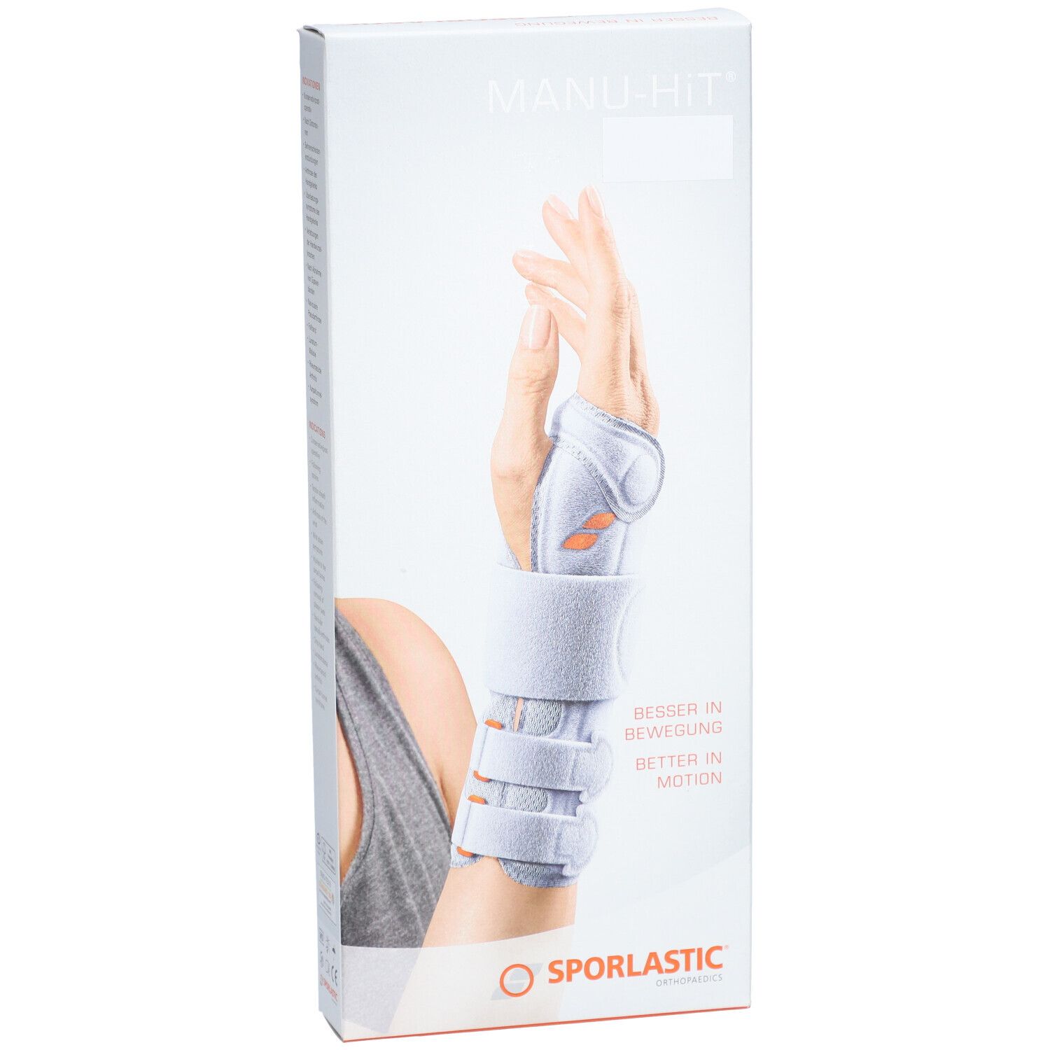 Verpakking van de polsbrace. Opschrift: MANU-HIT, SPORLASTIC. Afbeelding van een hand met brace.