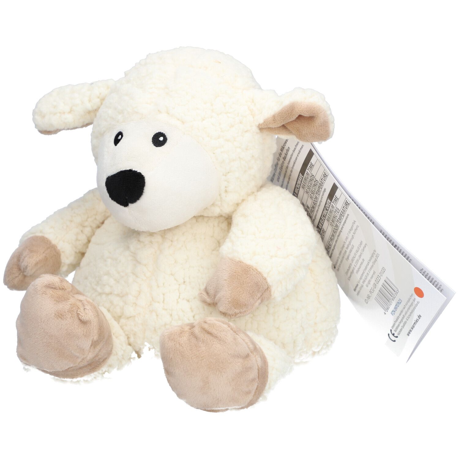 Peluche mouton blanc, bouche noire, pieds beiges. Étiquette avec informations produit.