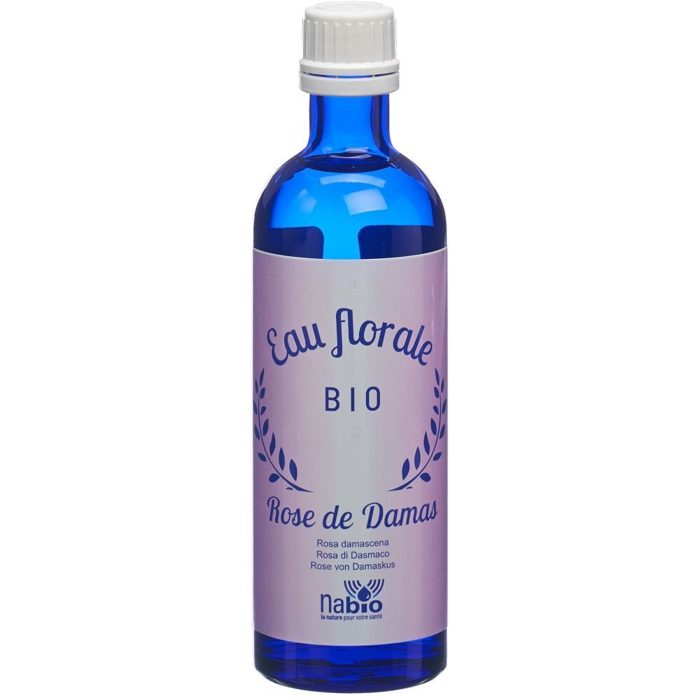Flacon en verre bleu avec bouchon blanc. Étiquette "Eau florale BIO Rose de Damas".