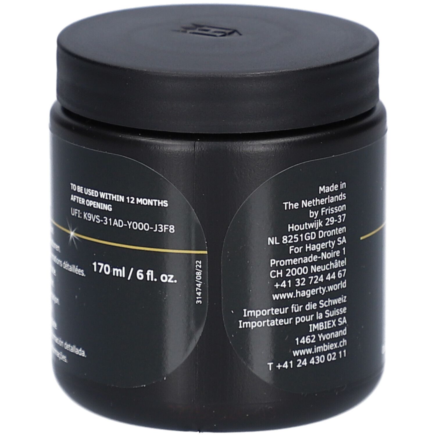 Boîte noire avec couvercle. Texte: "170 ml / 6 fl. oz.". Informations d'adresse et date de péremption.