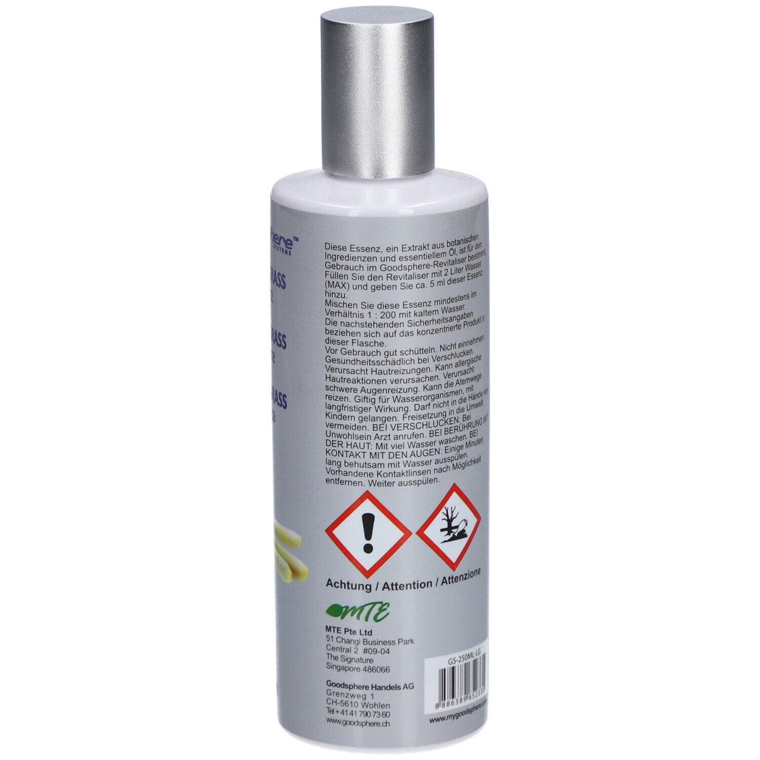 Achterkant van de fles. Tekst in meerdere talen. Gevaarsymbolen. Zilveren dop.