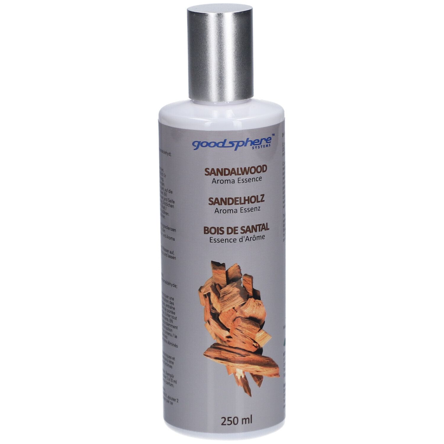 Fles met zilveren dop. Opschrift: Sandalwood Aroma Essence. Illustratie van stukken hout. 250 ml.