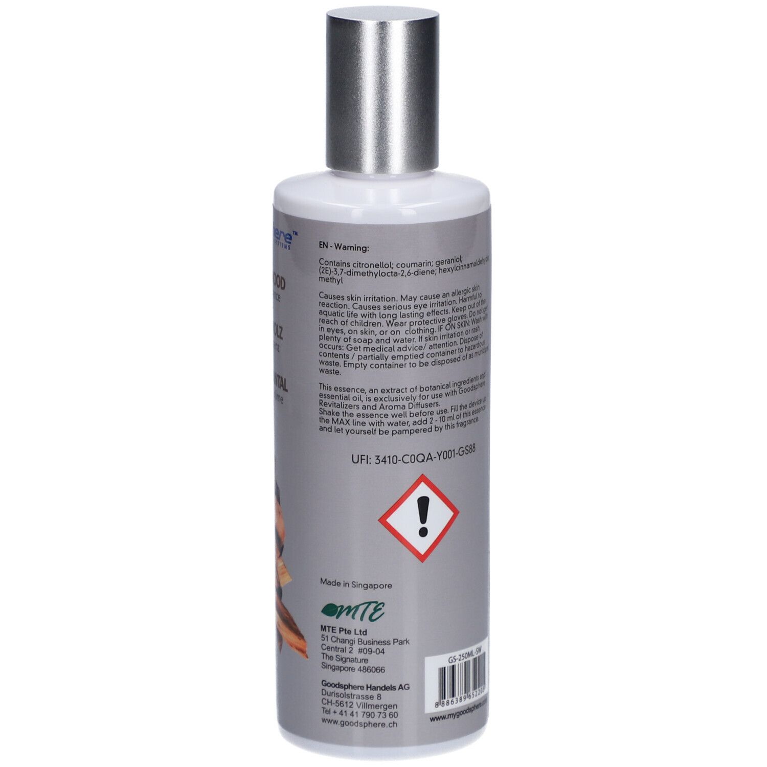 Fles met zilveren dop. Achterkant met Engelse tekst. Bevat waarschuwingen en ingrediënten.