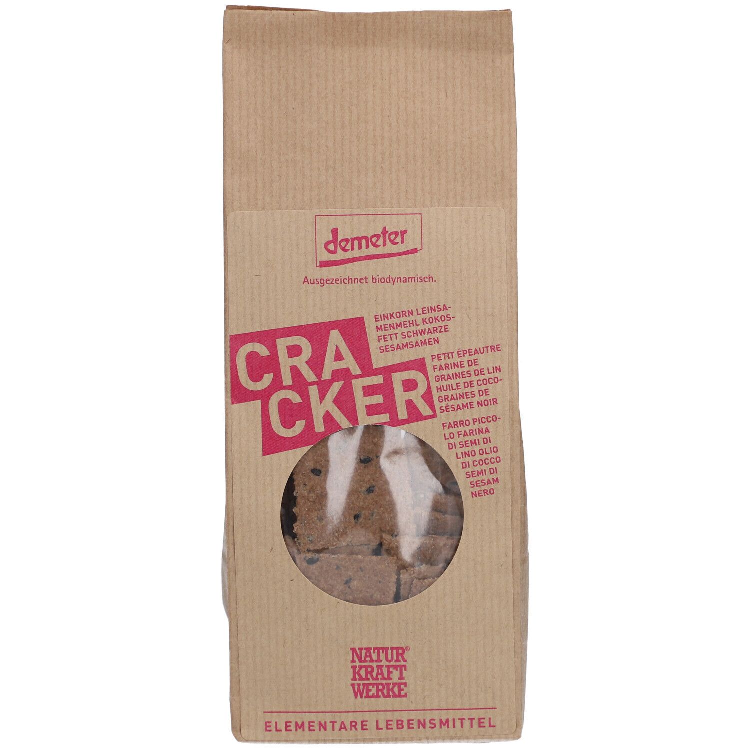 Sachet en papier brun avec fenêtre ronde. Inscription "CRACKER" et "demeter". Visibles : crackers aux graines.