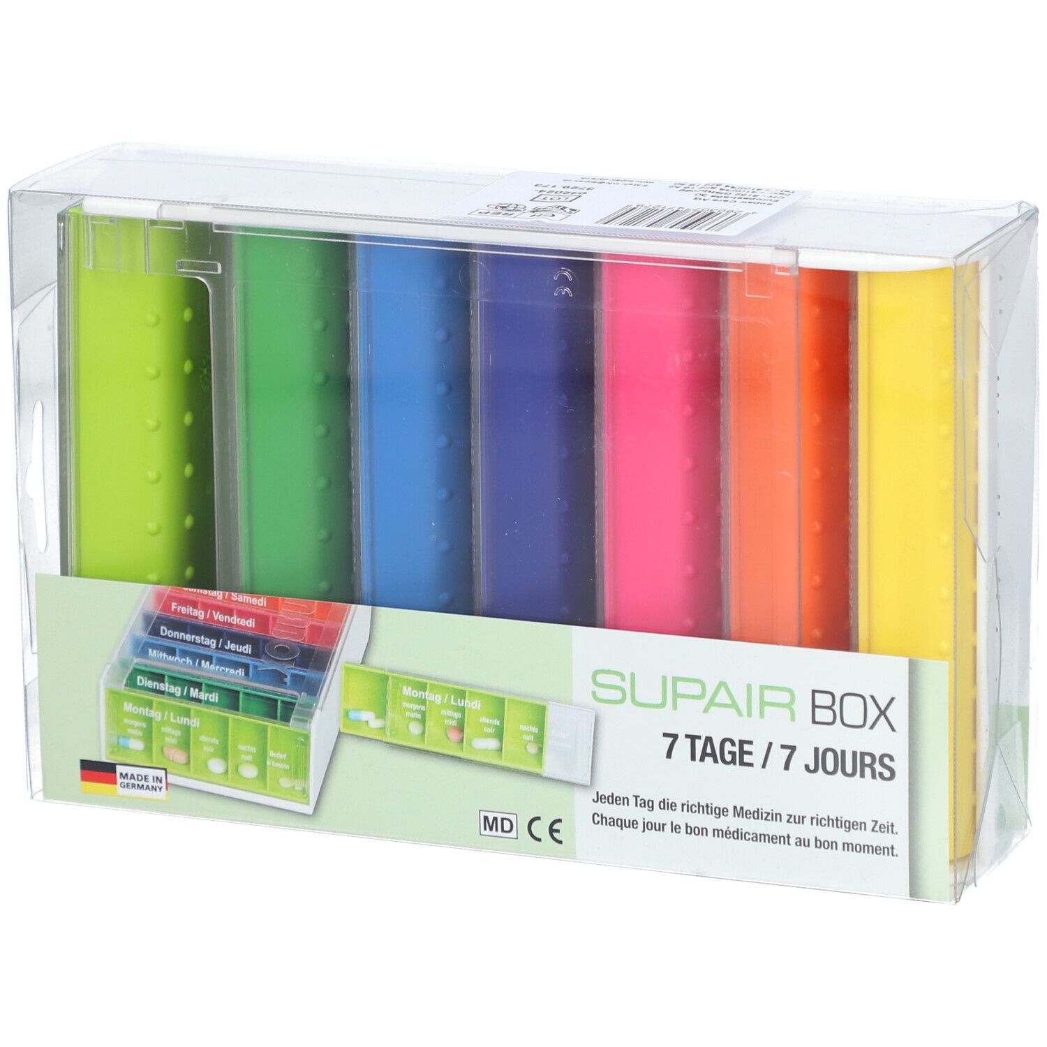 SUPAIRBOX Semainier Rainbow. Boîte à pilules 7 jours avec compartiments colorés. Emballé dans du plastique transparent. Avec texte allemand.