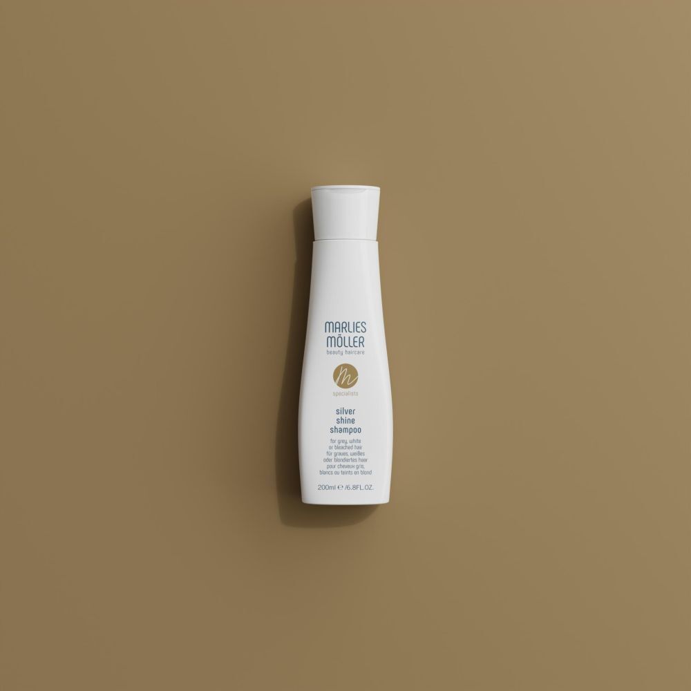 Marlies Möller Silver Shine Shampoo. Shampooing blanc sur fond marron. Inscription : Silver Shine Shampoo. 200ml.