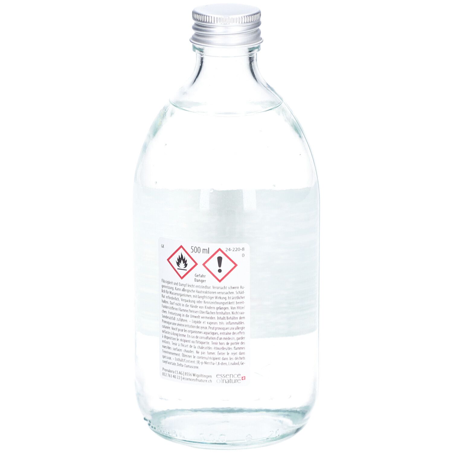 Flacon en verre avec bouchon argenté. Dos avec étiquette. Avertissements et informations sur le produit. 500 ml.