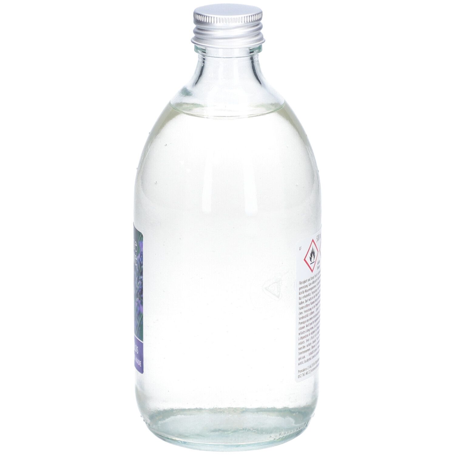 Glazen fles met zilveren dop. Etiket met waarschuwingssymbolen. Vloeistof binnenin.