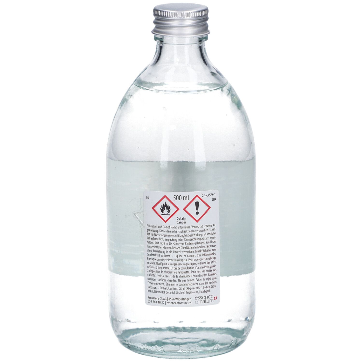 Glazen fles met zilveren dop. Achterkant met tekst, waarschuwingen en 500 ml indicatie. Heldere inhoud.