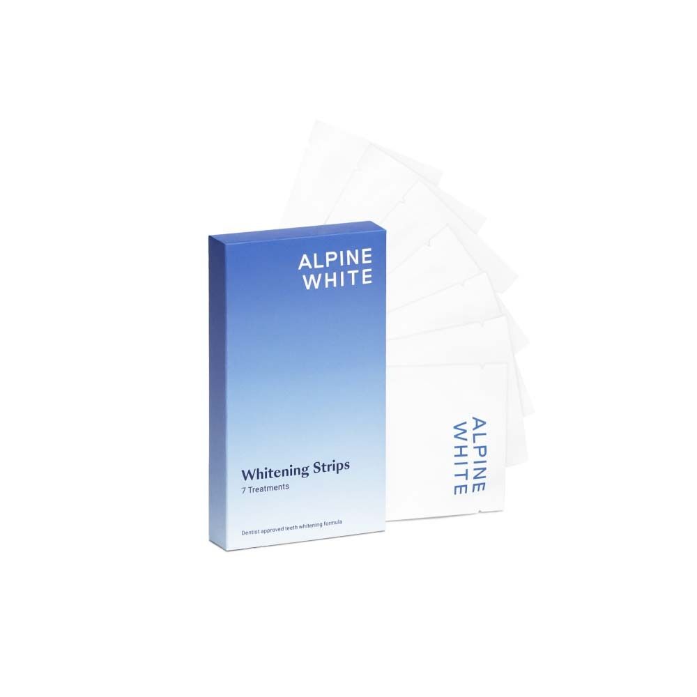 Boîte bleue et blanche ALPINE WHITE Whitening Stripes. 7 traitements. Bandes individuelles à côté.