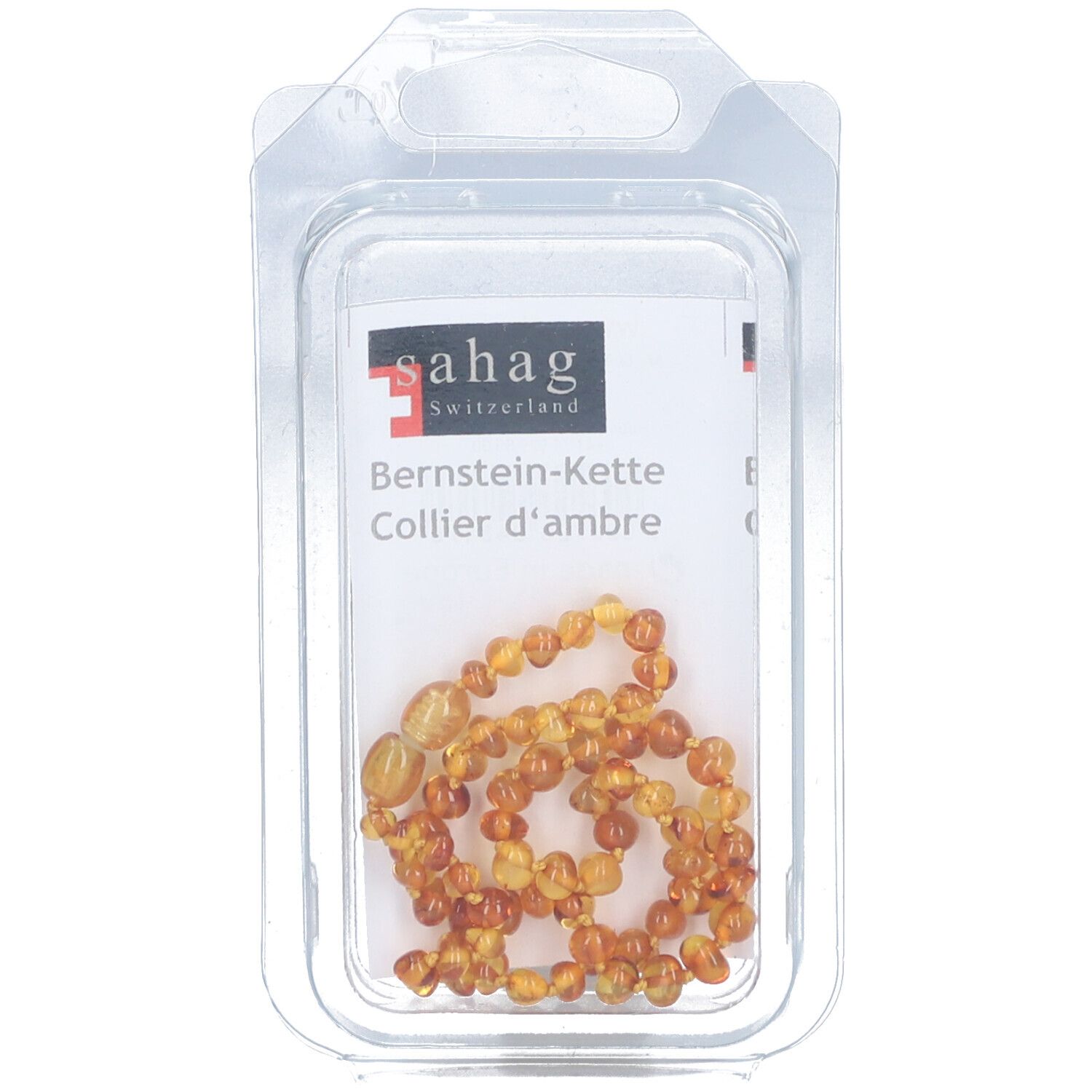 Barnsteenketting in blisterverpakking. Sahag-logo. Ketting van barnsteenkleurige kralen. Tekst: Bernstein-Kette, Collier d'ambre.