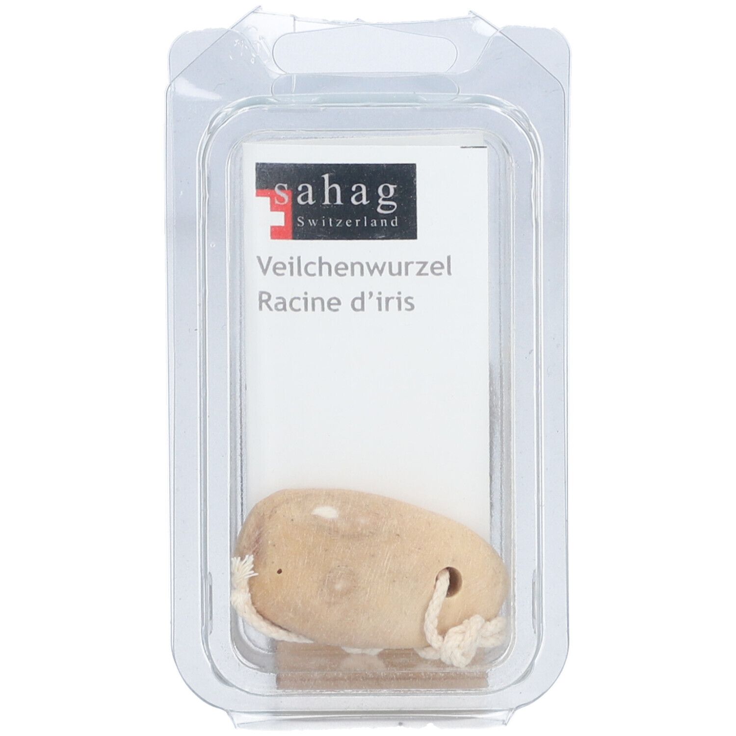 Beige wortel met koord in transparante verpakking. Wit etiket met 'sahag' en 'Veilchenwurzel'.