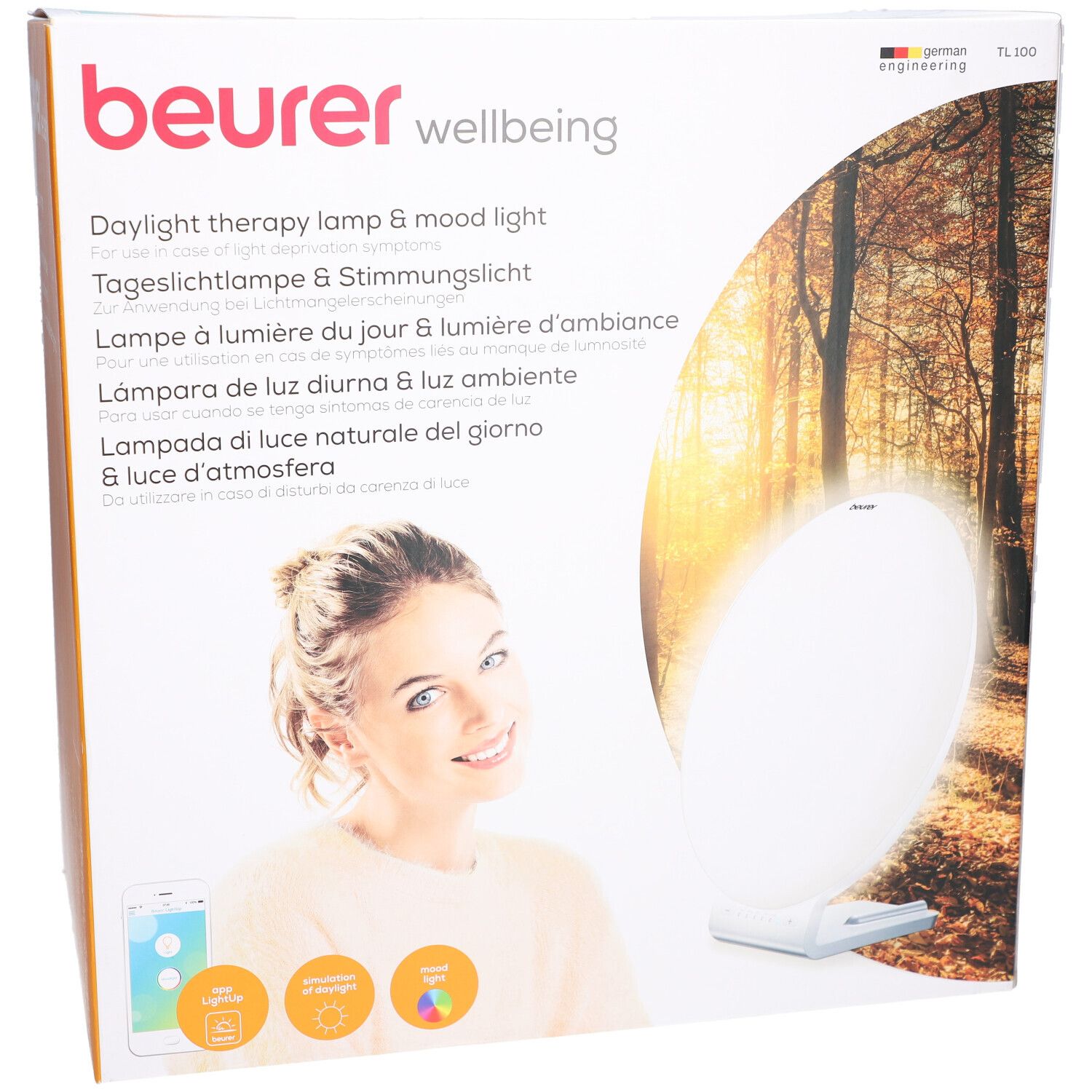 Beurer TL 100 verpakking. Opdruk: Daglichttherapielamp & sfeerverlichting. Vrouw met smartphone. Productafbeelding.
