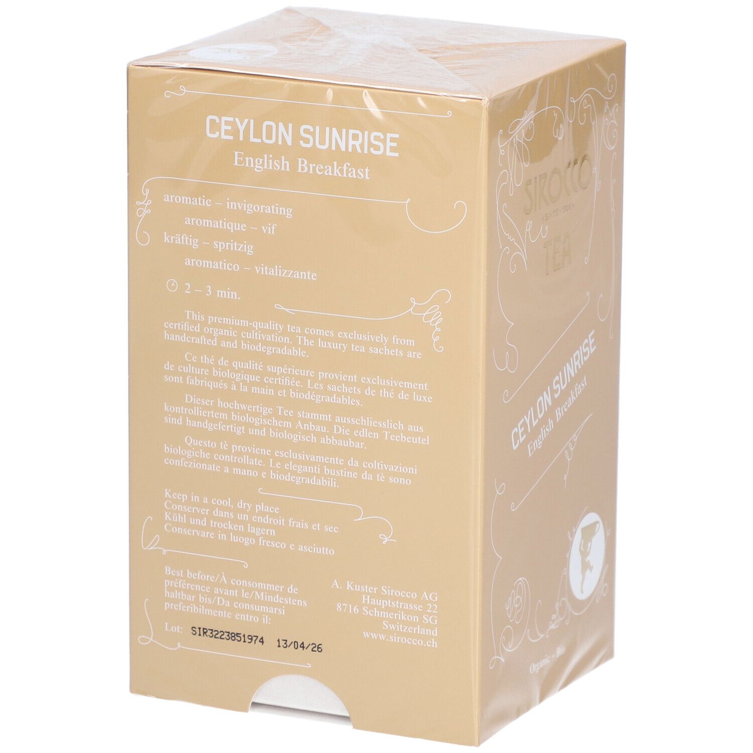Zijkant van de theeverpakking. Opschrift: Ceylon Sunrise English Breakfast. Bevat informatie over bereiding en opslag.