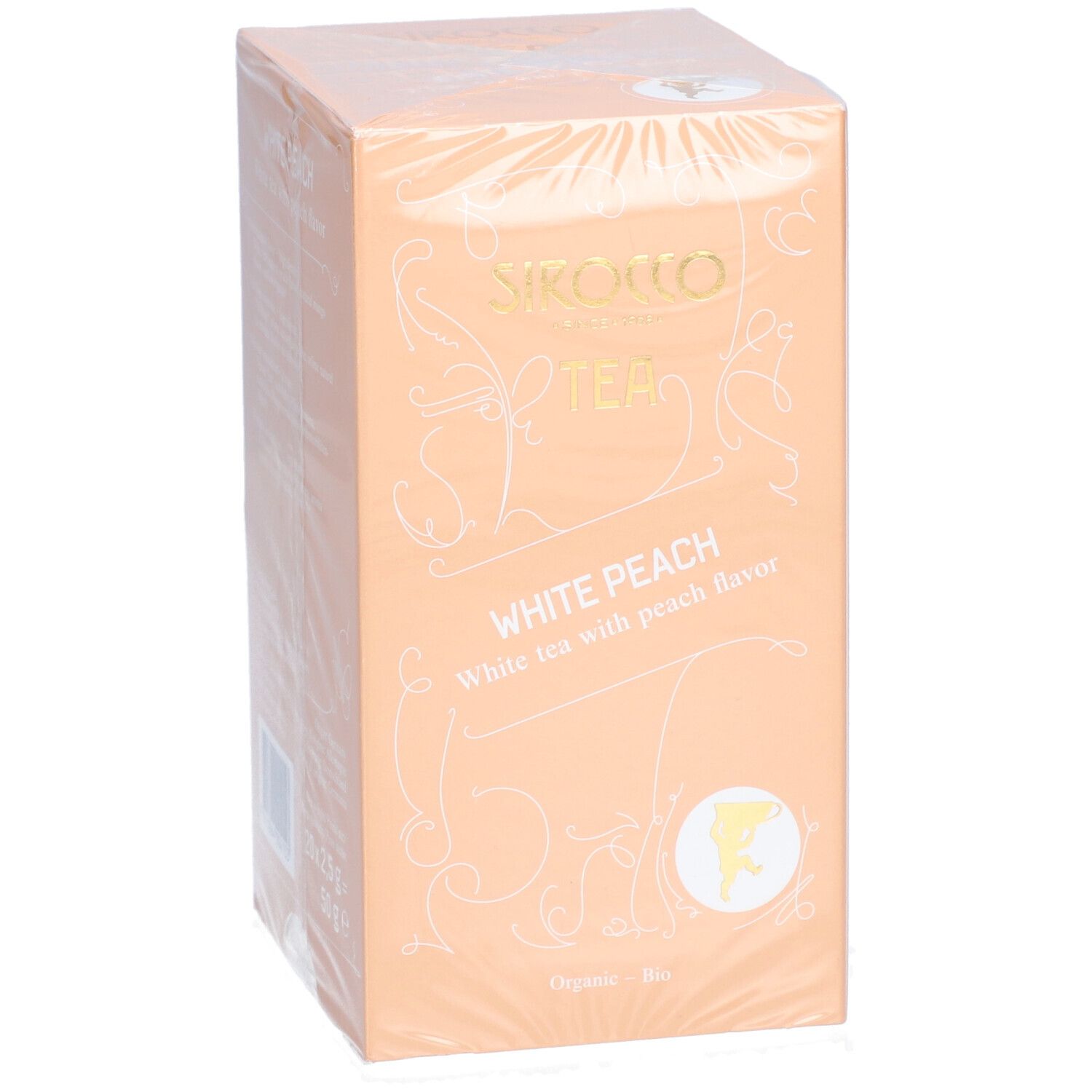 Theedoos verpakt in folie. Opschrift: Sirocco Tea, White Peach, witte thee met perziksmaak. Logo en tekst in goud.