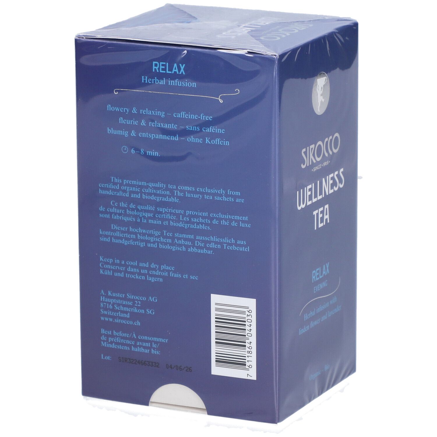Achterkant van de blauwe doos. Tekst over eigenschappen, bereiding en opslag. "Sirocco Wellness Tea" en "Relax Evening".
