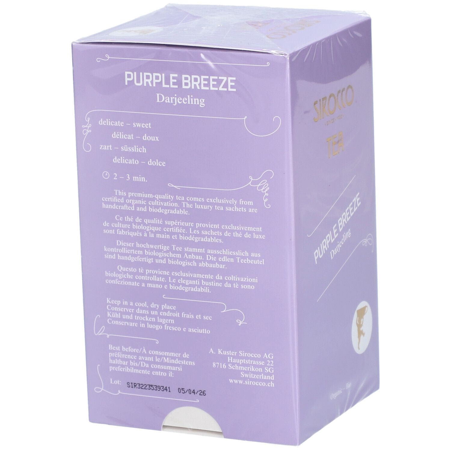 Côté de l'emballage du thé Sirocco. Contient des informations sur la préparation, la durabilité et les certifications. Fond violet.