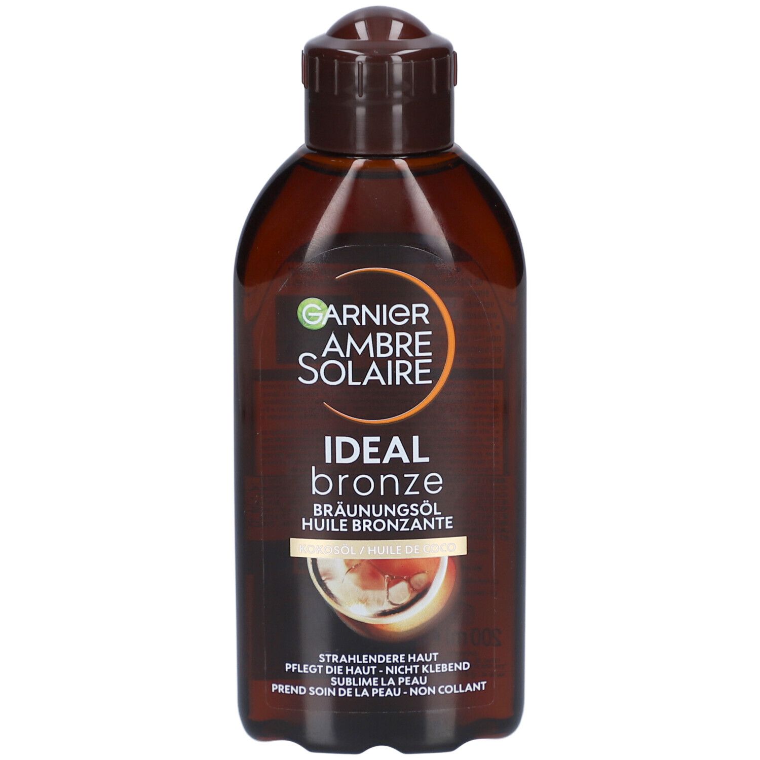 Huile bronzante dans un flacon. Inscription: GARNIER Ambre Solaire, Ideal Bronze. Bouchon marron.
