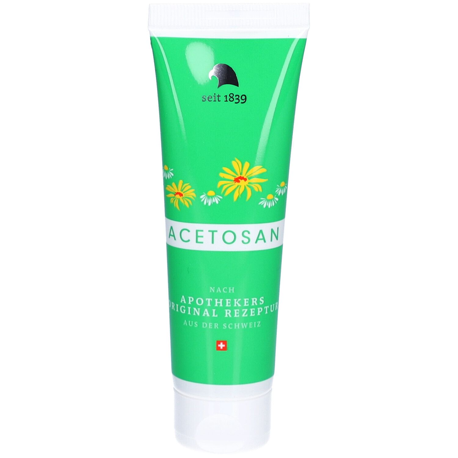 Groene tube met witte dop, opschrift ACETOSAN, kamille- en arnicabloemen.