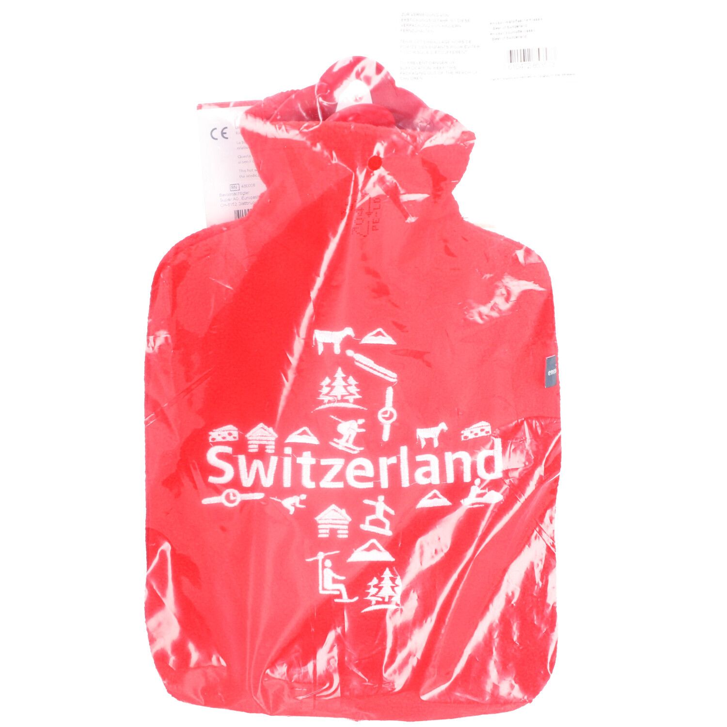Rode warmwaterkruik in plastic verpakking. Opschrift "Switzerland" met symbolen. CE-markering.