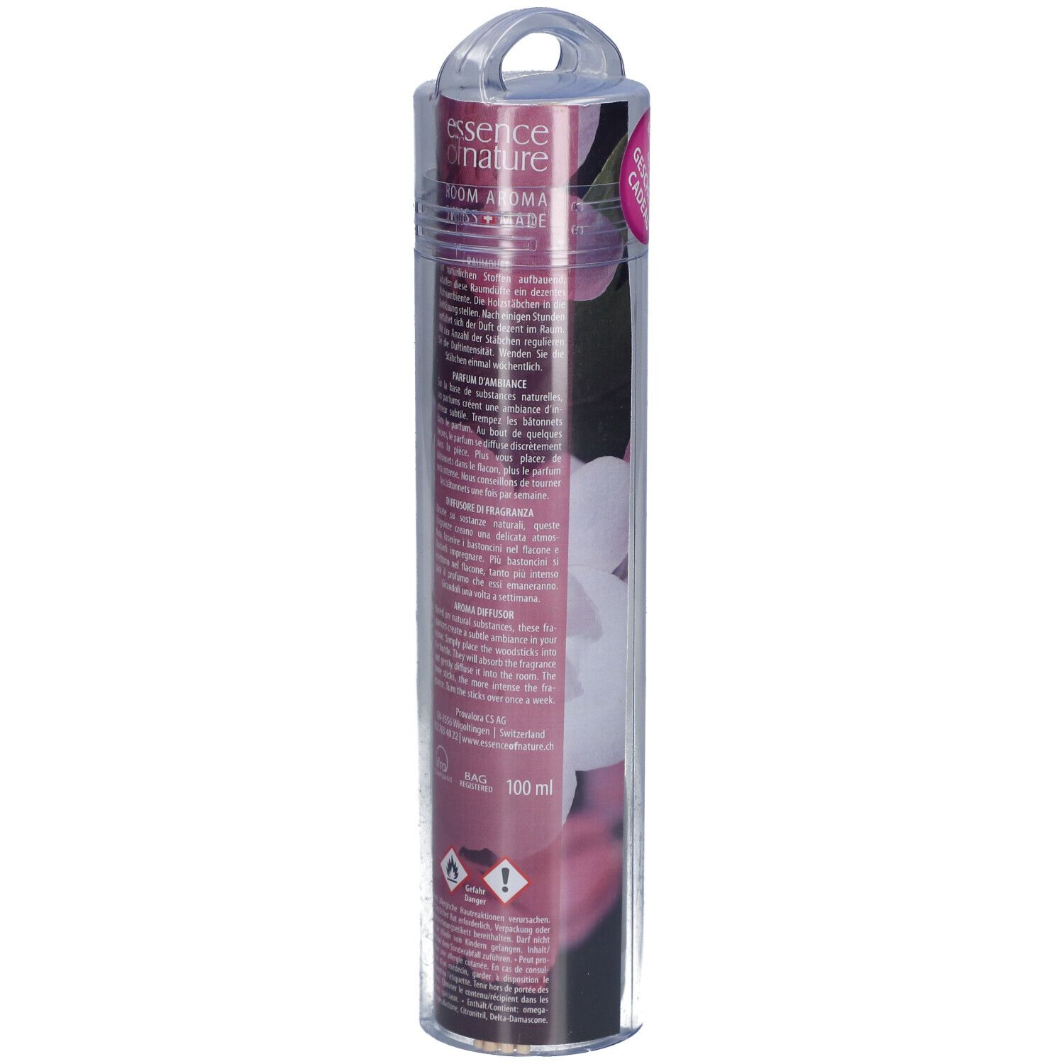 Transparante verpakking met geurstokjes. Achterkant met productinformatie en bloemenontwerp. Bevat een 100 ml indicatie.