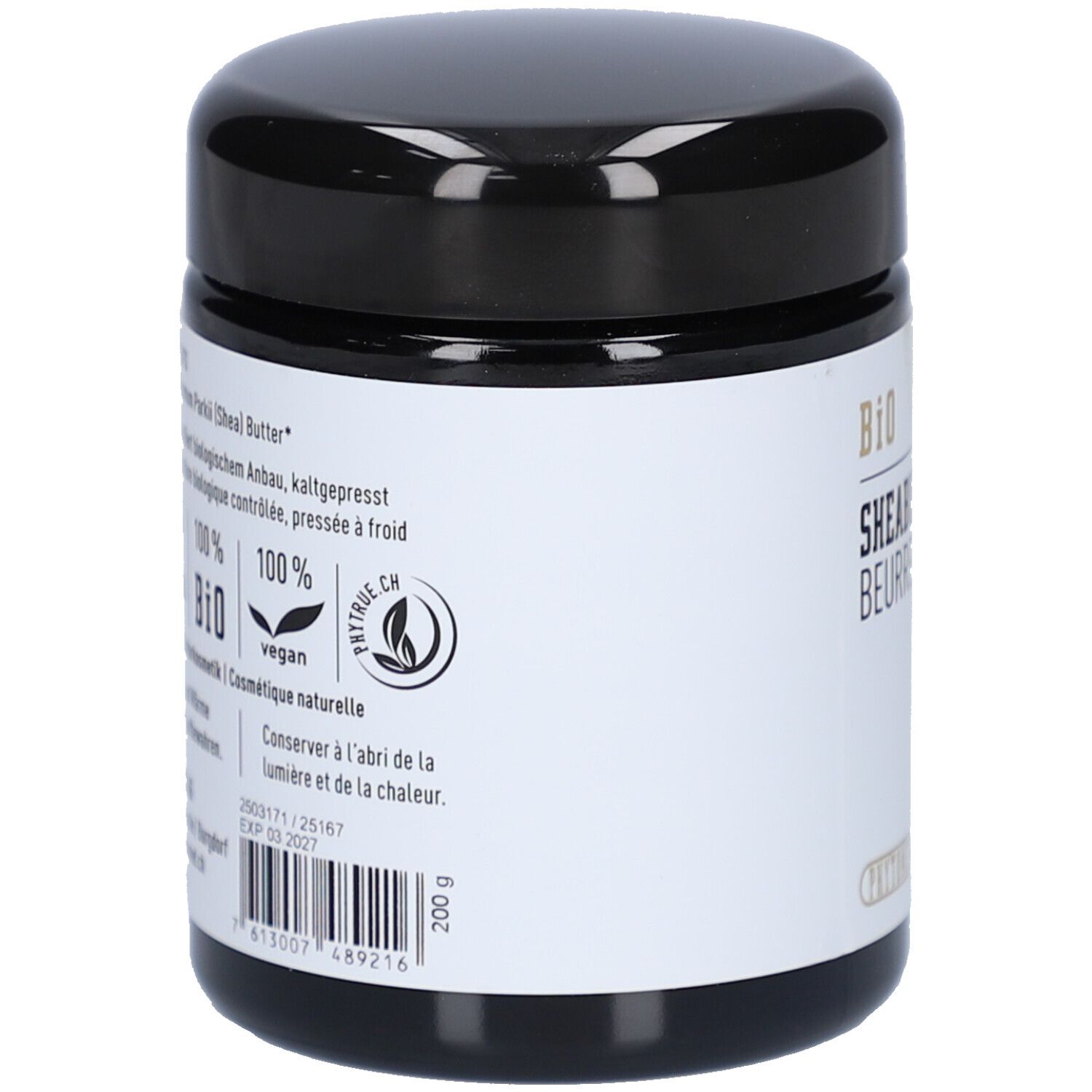 Dos du pot noir. Étiquette avec texte: Sheabutter, 100% BIO, vegan. Durée de conservation jusqu'à 03.2027.