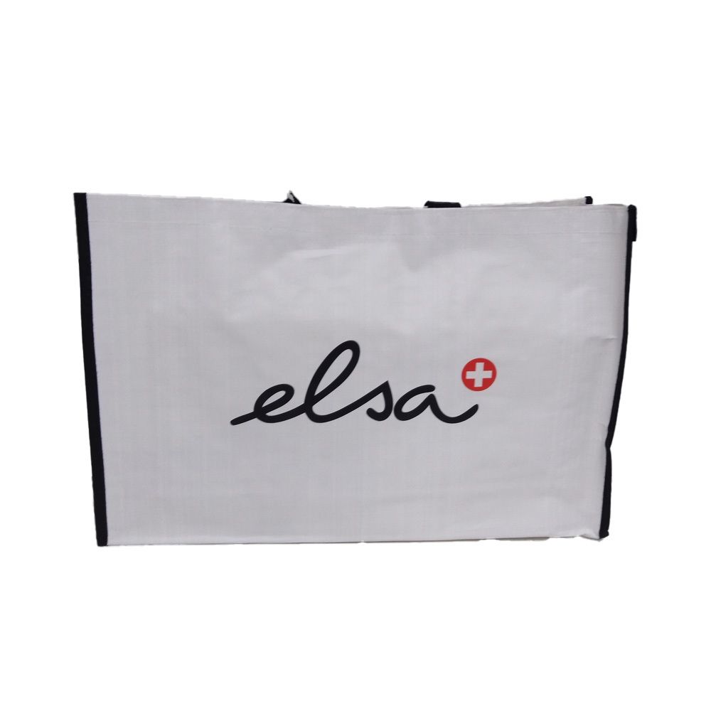 Witte tas met zwarte rand en handvatten. Opschrift "elsa" in zwart en rood kruis.
