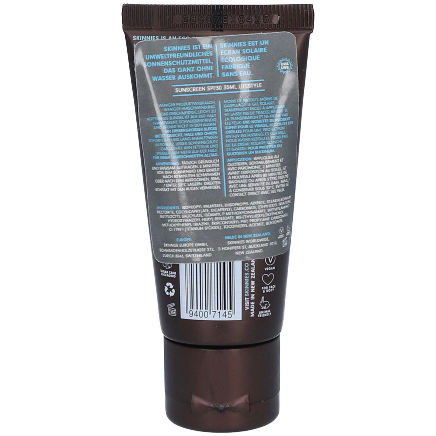 Dos du tube marron SKINNIES Sonnengel. Texte et code-barres visibles. Autocollant transparent avec texte.