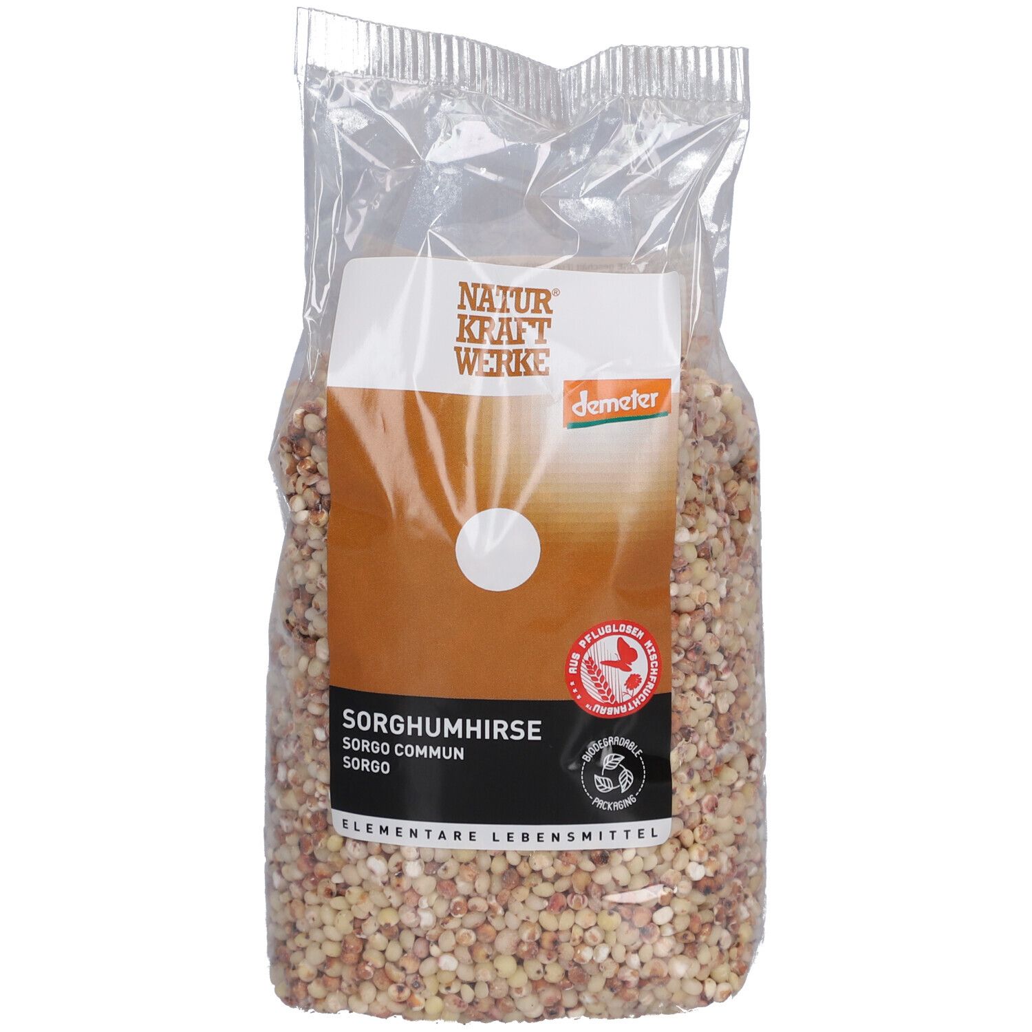 Emballage transparent de sorgho. Étiquette avec nom du produit, marque NATURKRAFTWERKE et label Demeter. Contenu visible.