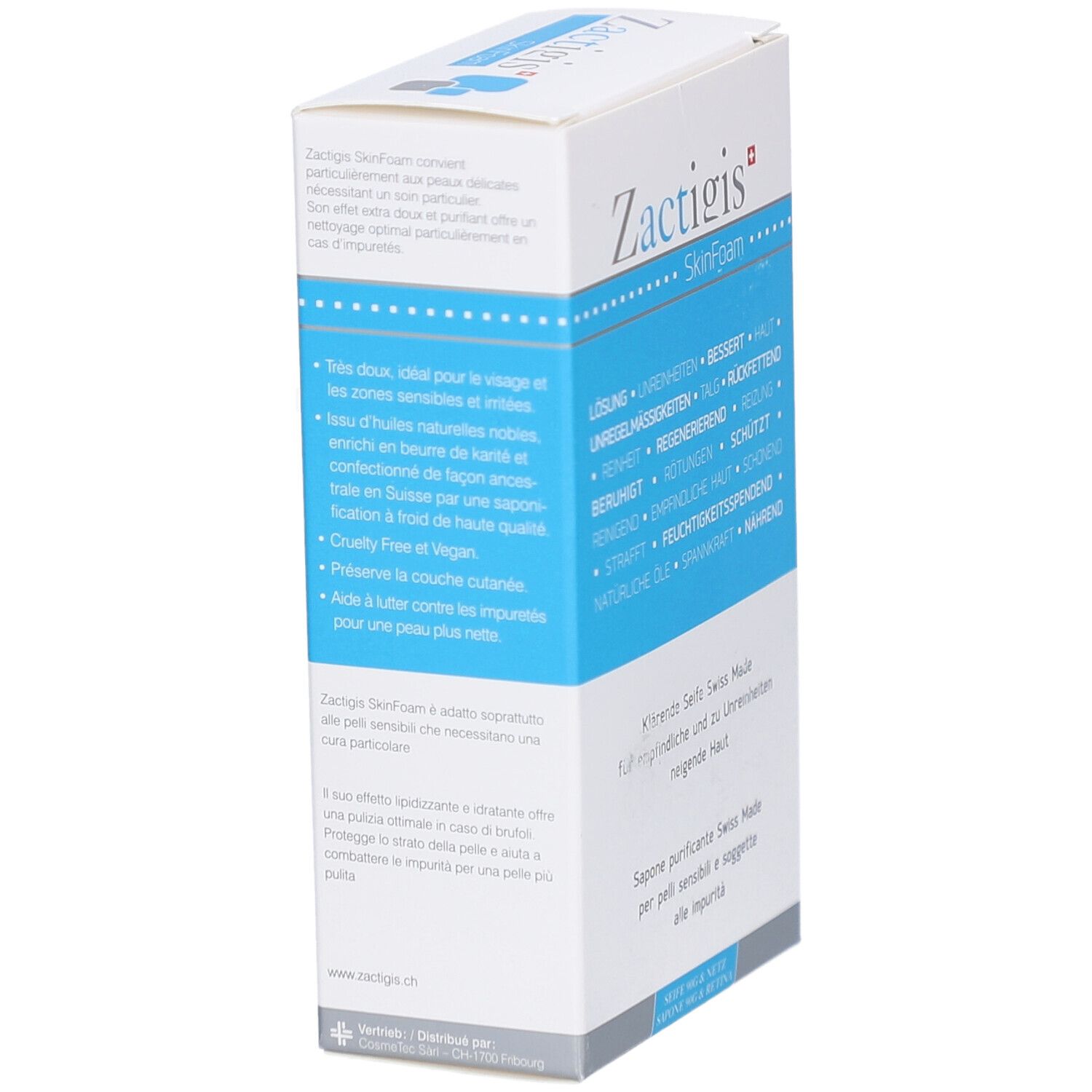 Wit en blauw doosje. Opschrift: Zactigis SkinFoam. Tekst in het Duits, Frans en Italiaans. Schuine weergave van het product.