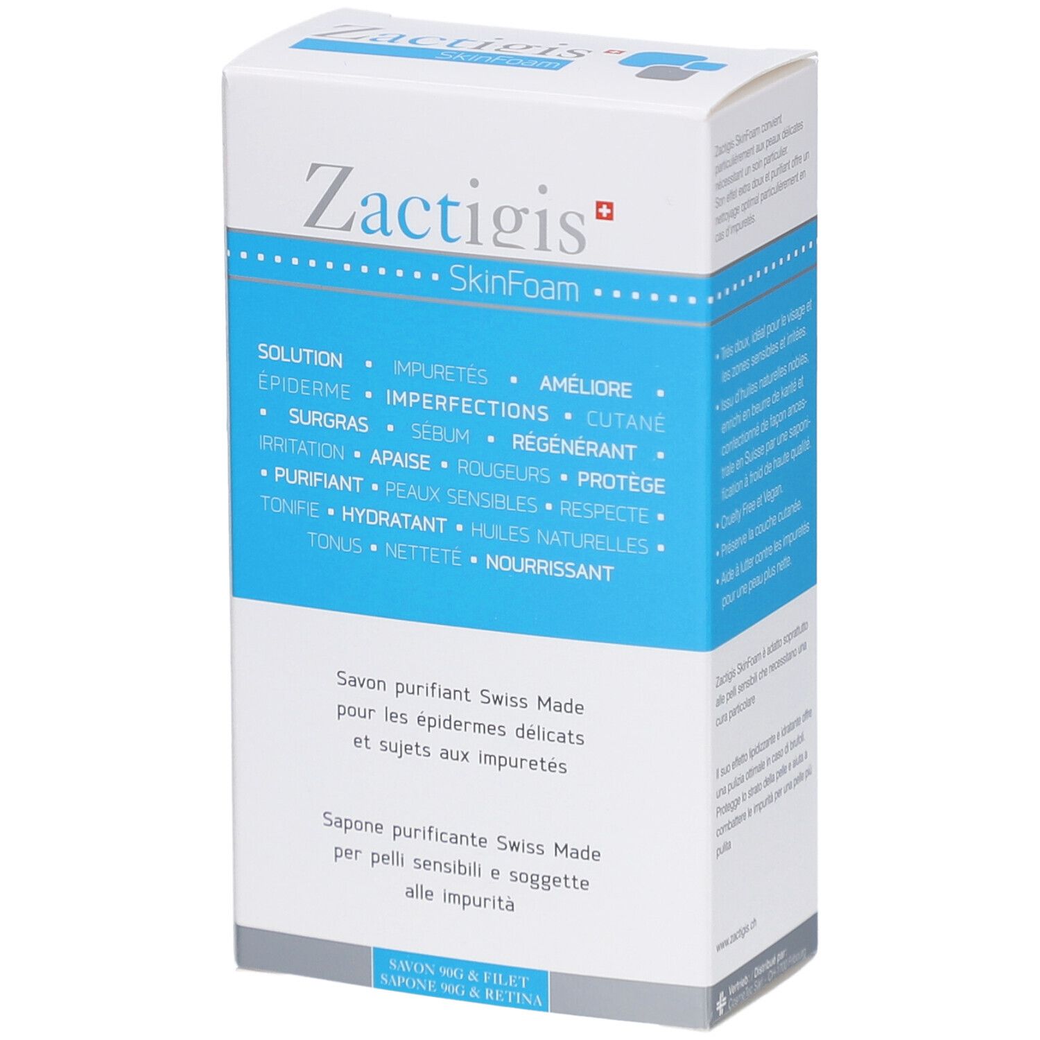 Wit en blauw doosje. Opschrift: Zactigis SkinFoam. Tekst in het Duits, Frans en Italiaans. Weergave van het product.